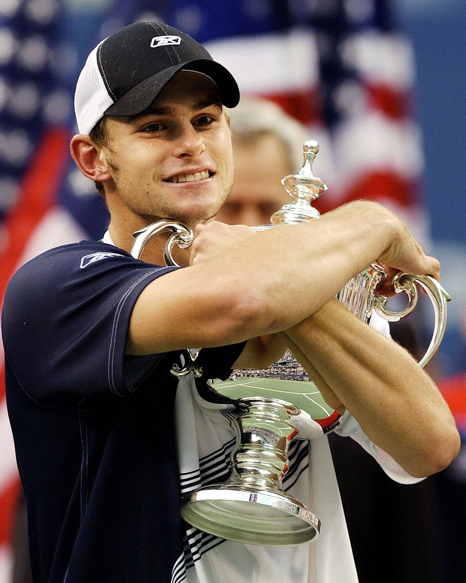 Andy Roddick Holding The Us Open Tennis Trophy Wallpaper