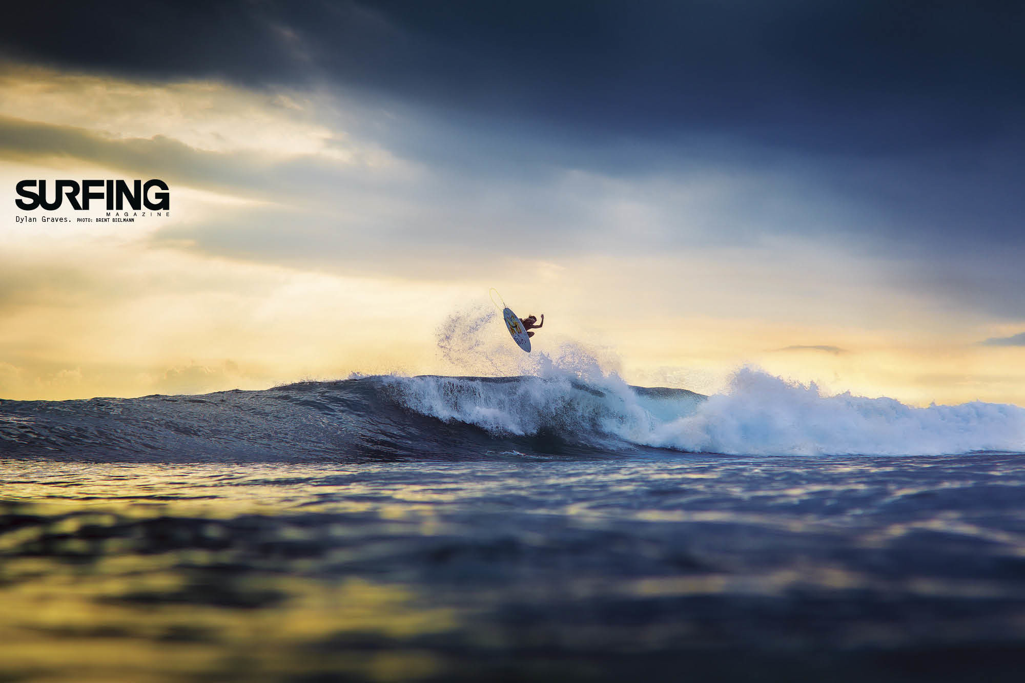 A surfer performs an aerial maneuver against a vibrant sunset backdrop, showcasing the dynamism and thrill of surfing