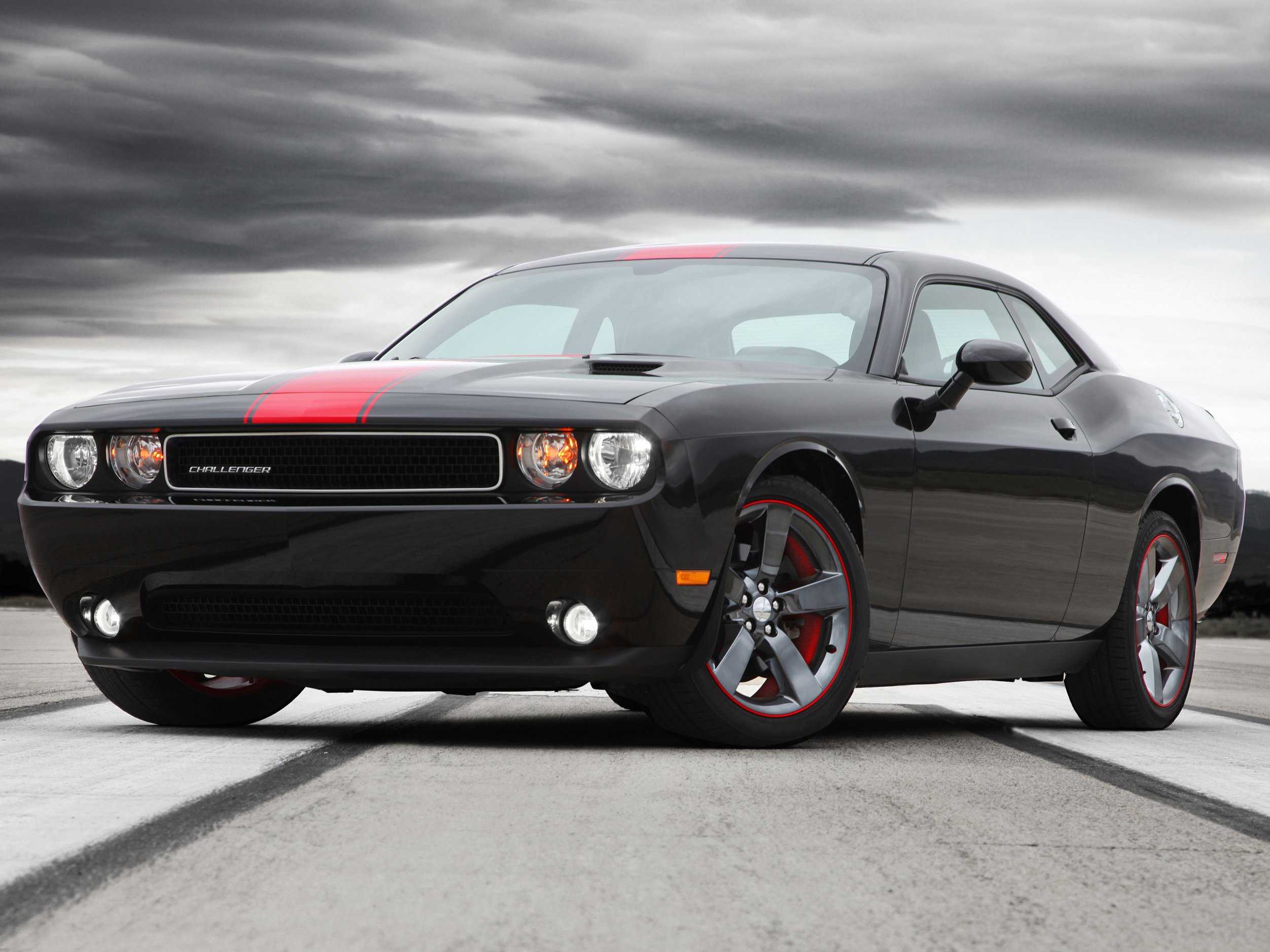 Black Dodge Challenger with Red Racing Stripes: A Fast and Furious Vibe