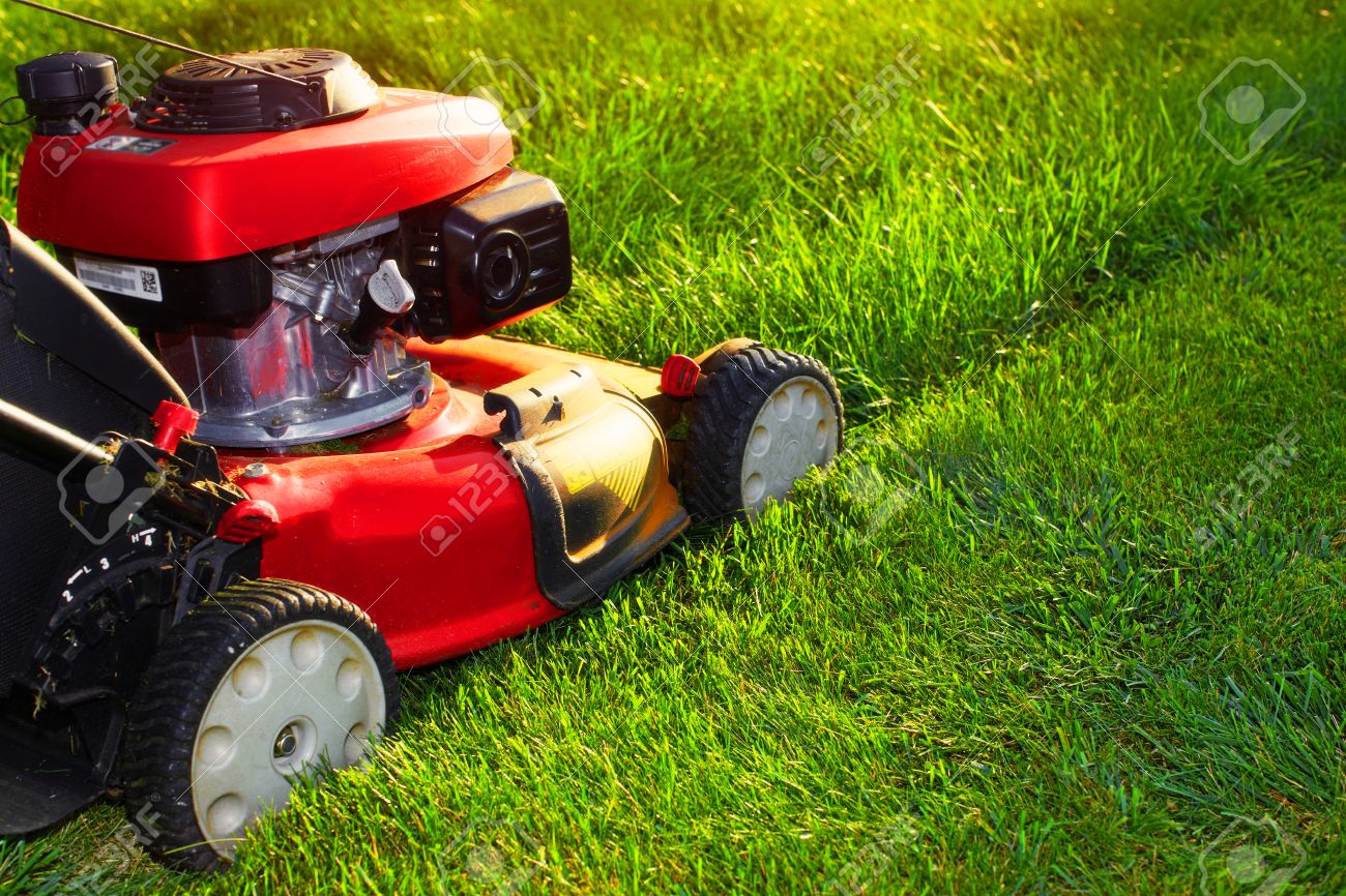 Red Lawn Mower Over Green Grass Background Stock Photo Picture