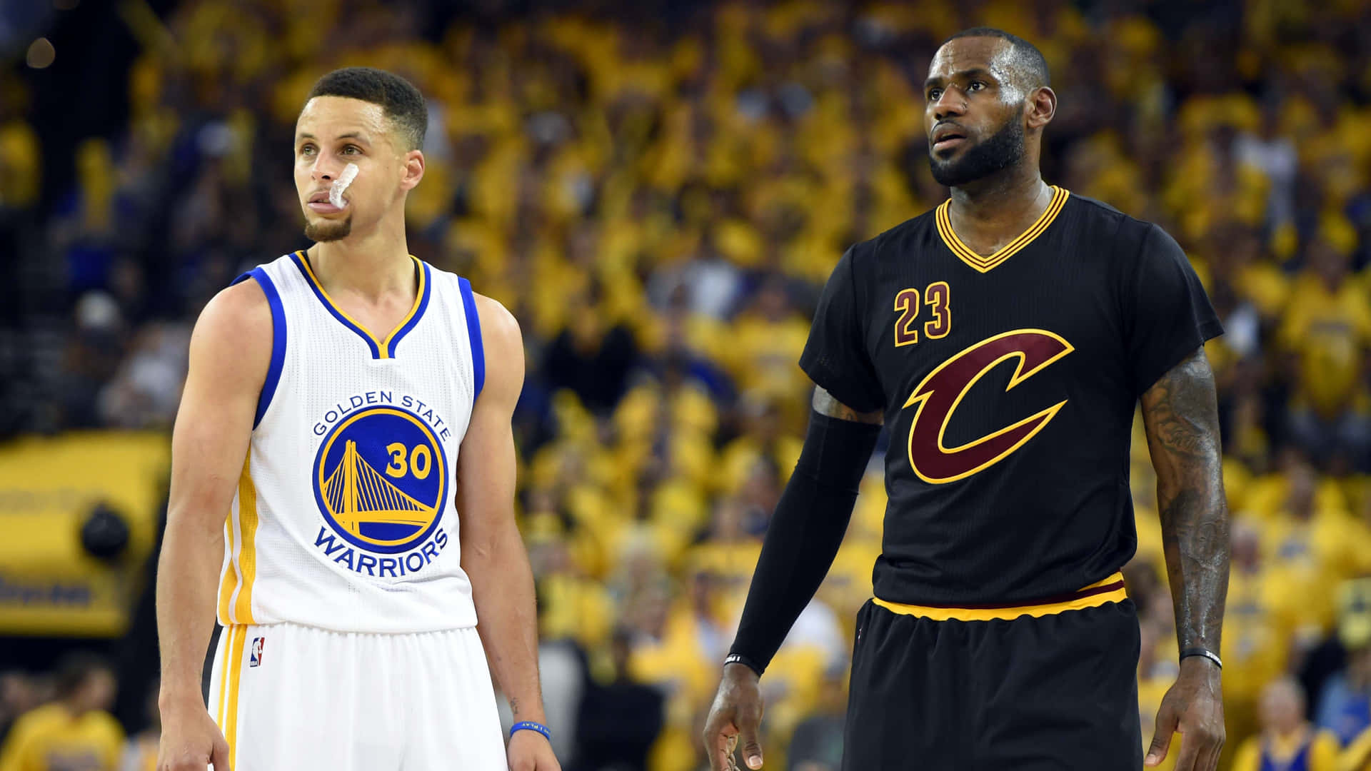 LeBron James and Stephen Curry face off during an NBA game, highlighting their rivalry and status as two of the greatest basketball players