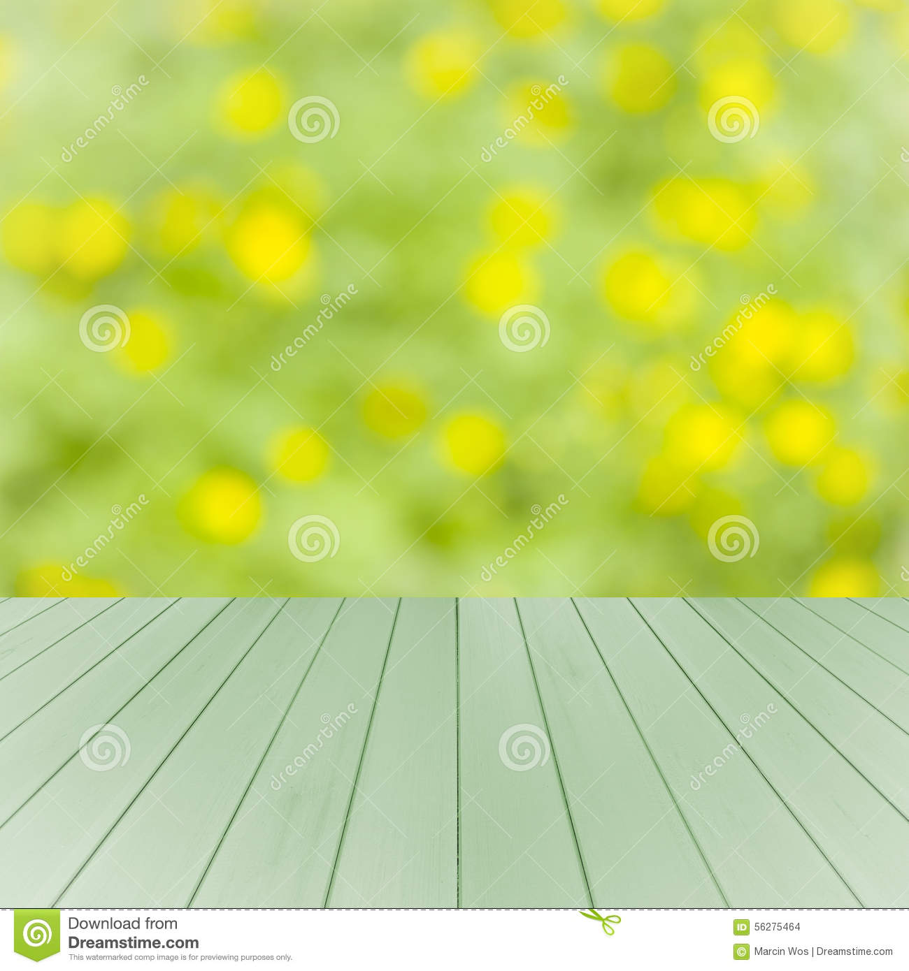 Empty Wooden Deck Table With Green And Yellow Soft Focus