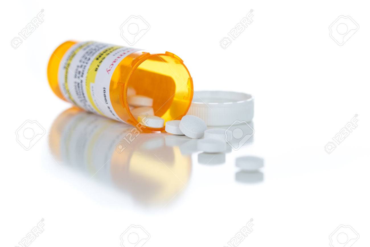 Non Proprietary Medicine Prescription Bottle And Spilled Pills