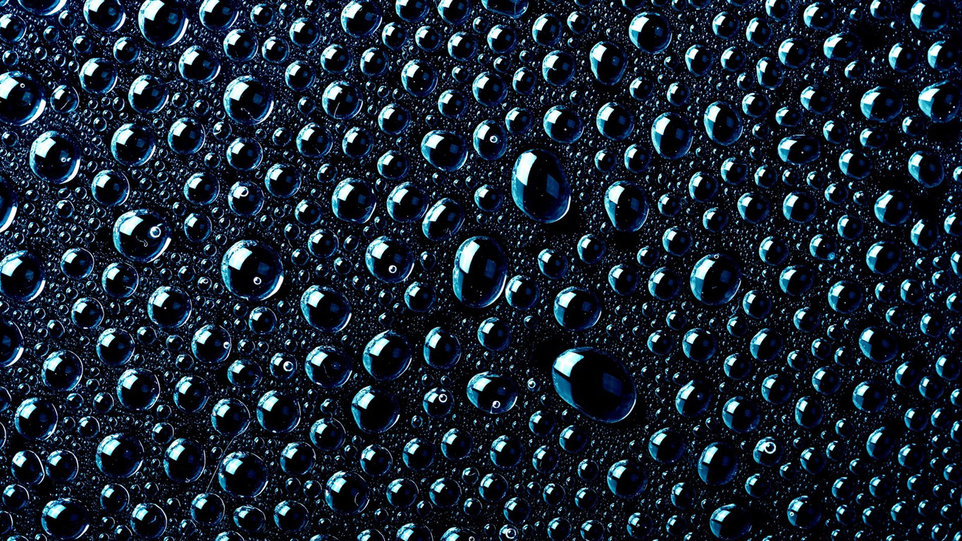 Water Drops On A Black Surface Wallpaper