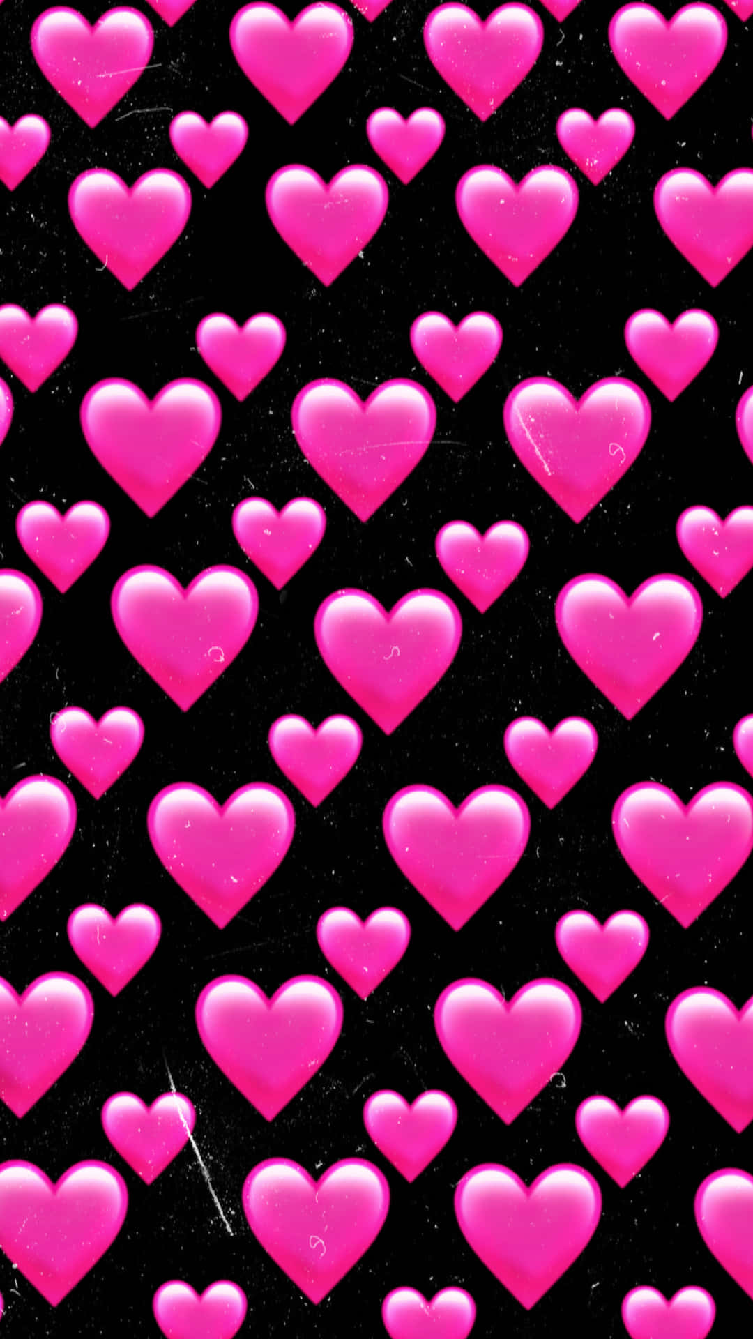 Vibrant pink hearts arranged on a black background, creating a striking and romantic visual