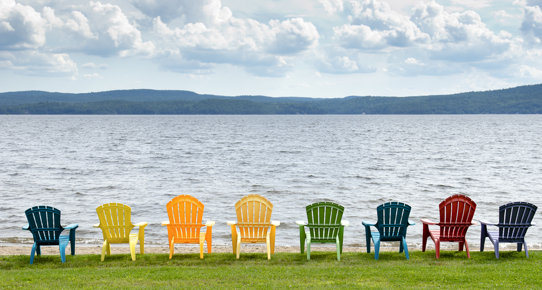 Colorful Adirondack Chairs On Beach Eight