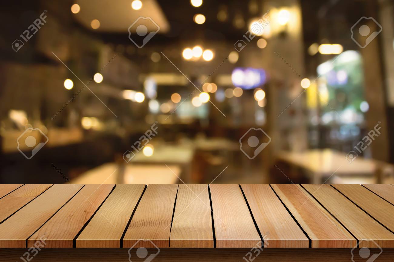 Wood Table Top On Blur Bokeh Cafe Background Can Be Used For