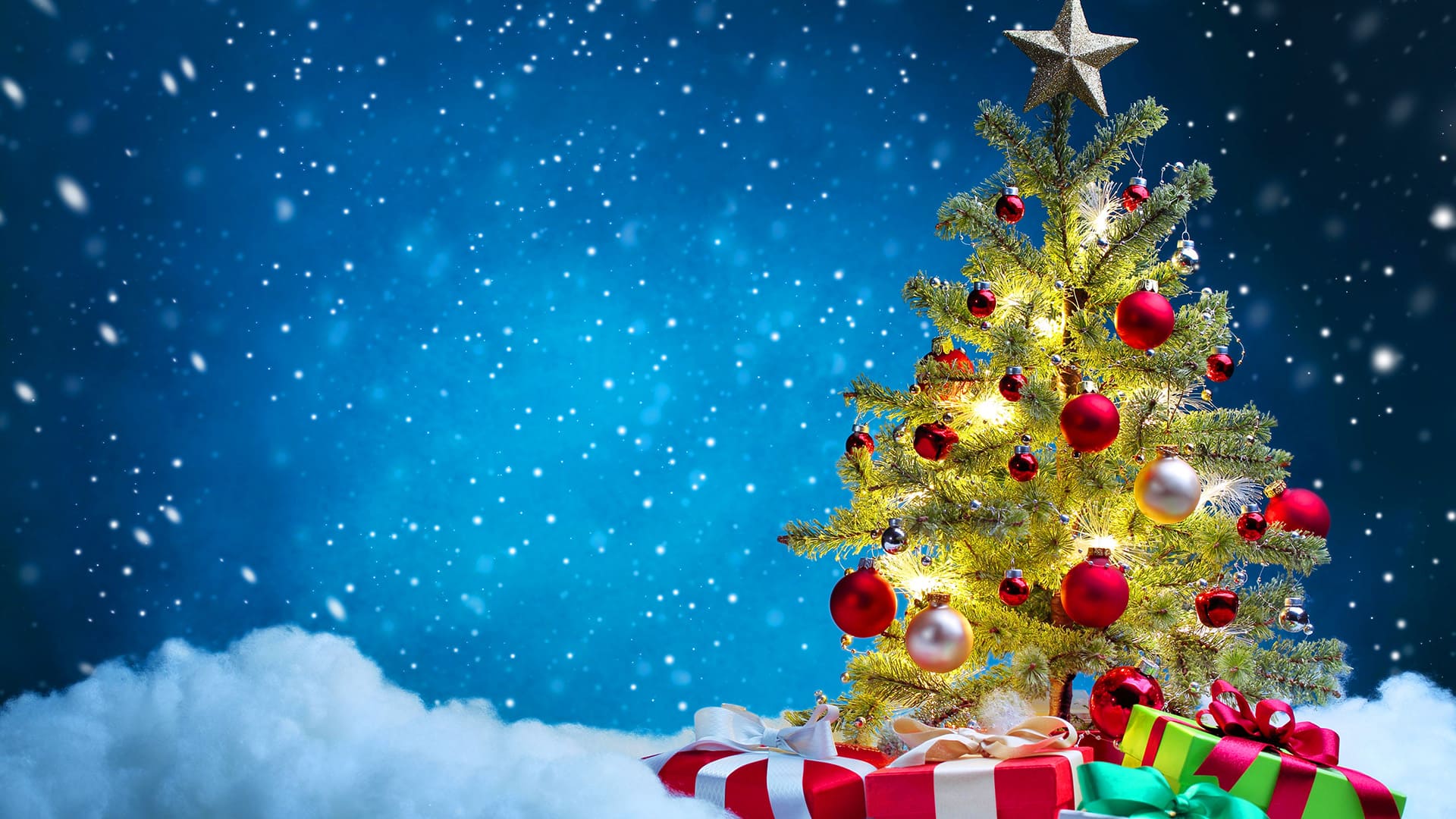 Christmas tree with ornaments and gifts on a snowy background, perfect for a New Year desktop wallpaper