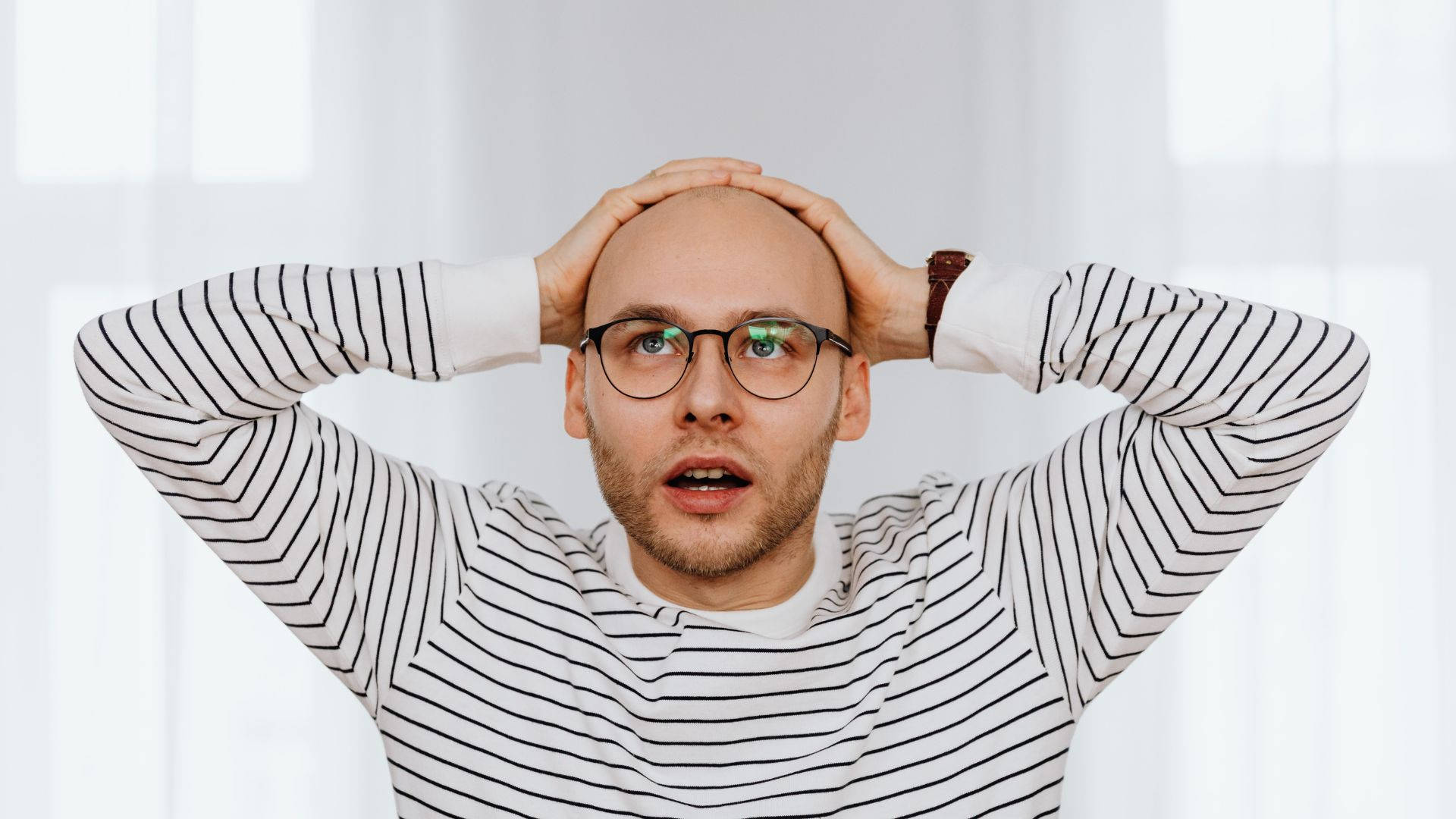 Bald Man With A Disbelief Reaction Wallpaper