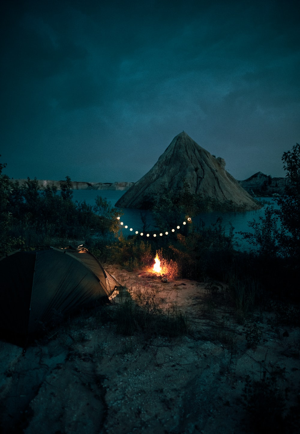 Bonfire Near Tent And Mountain During Night Time Photo