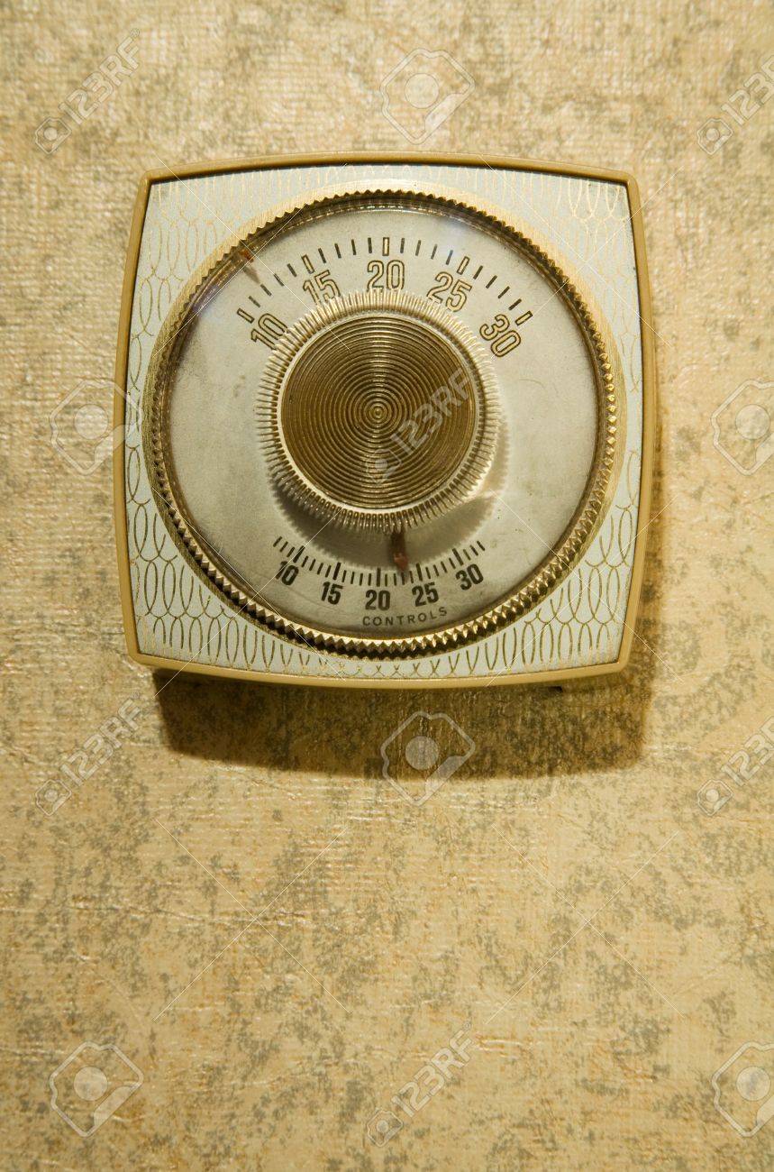 Old Fashioned Gold And Cream Thermostat Wallpaper Stock Photo