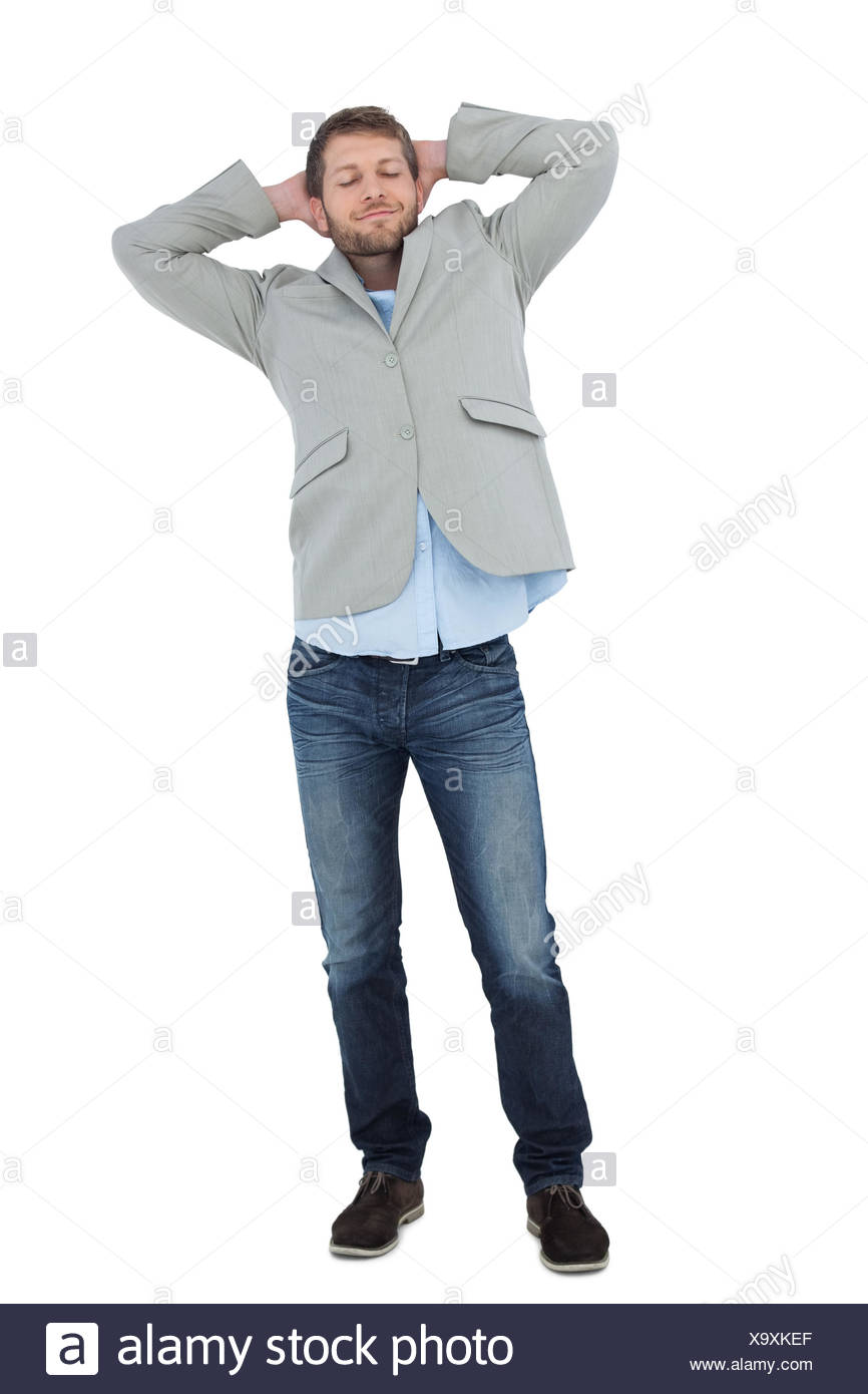 Suave Man In A Blazer With Hands Behind Head On White Background