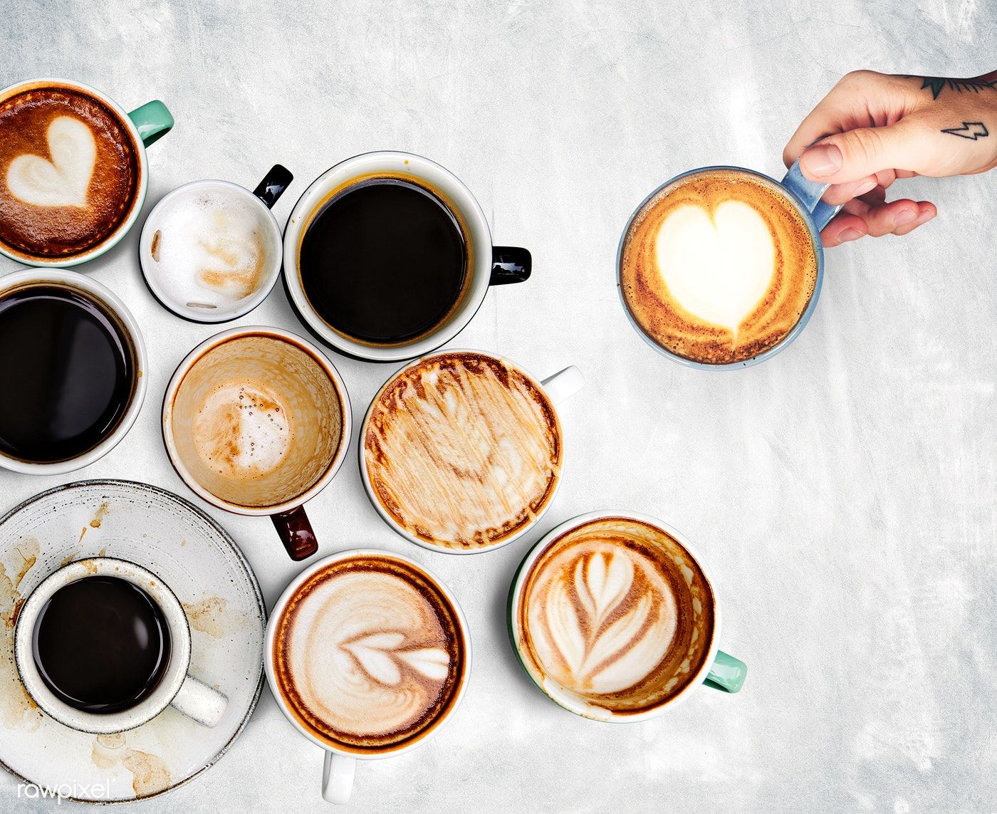 Premium Photo Of Assorted Coffee Cups On A Textured