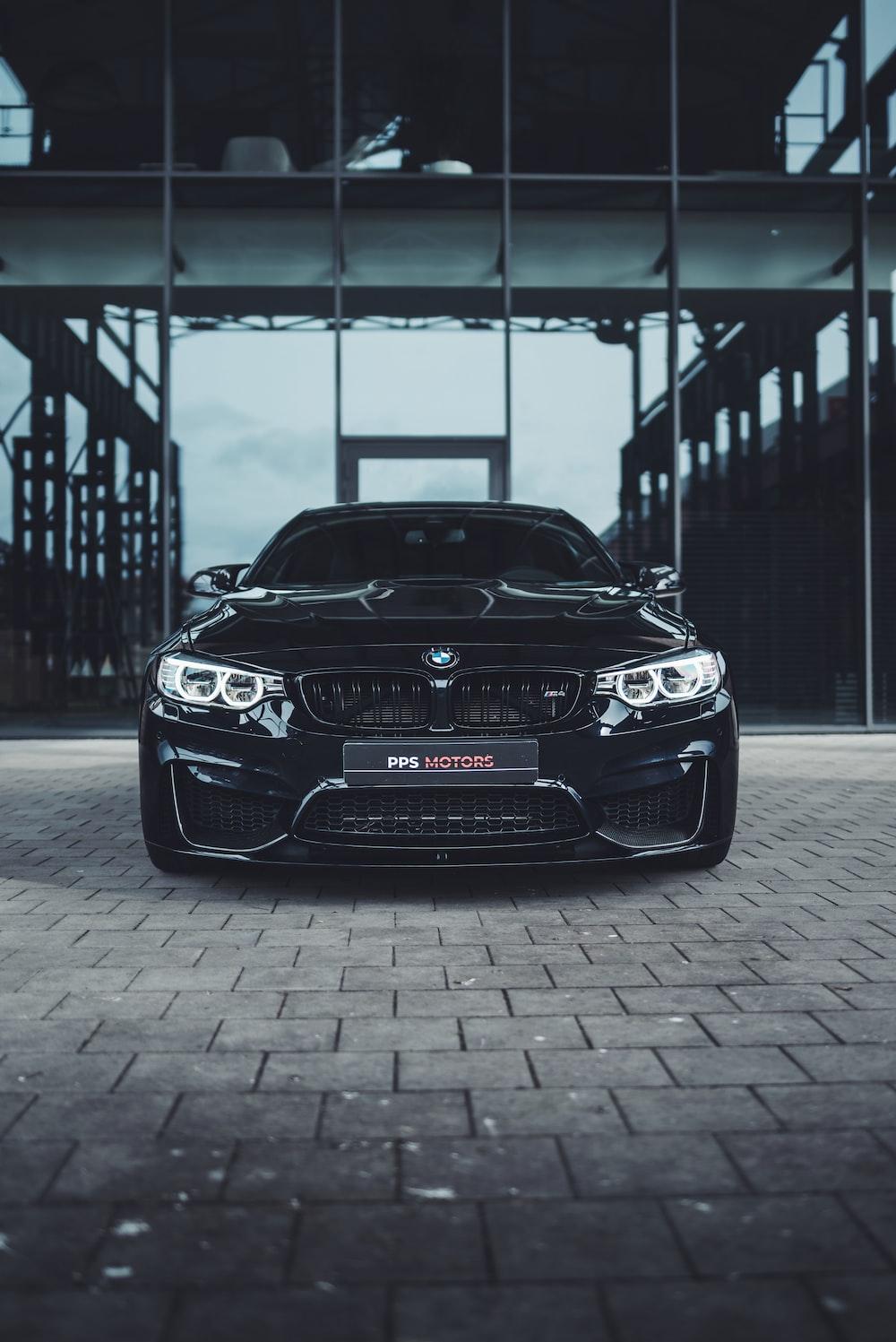 Black Bmw M Parked On Gray Concrete Pavement Photo Blue