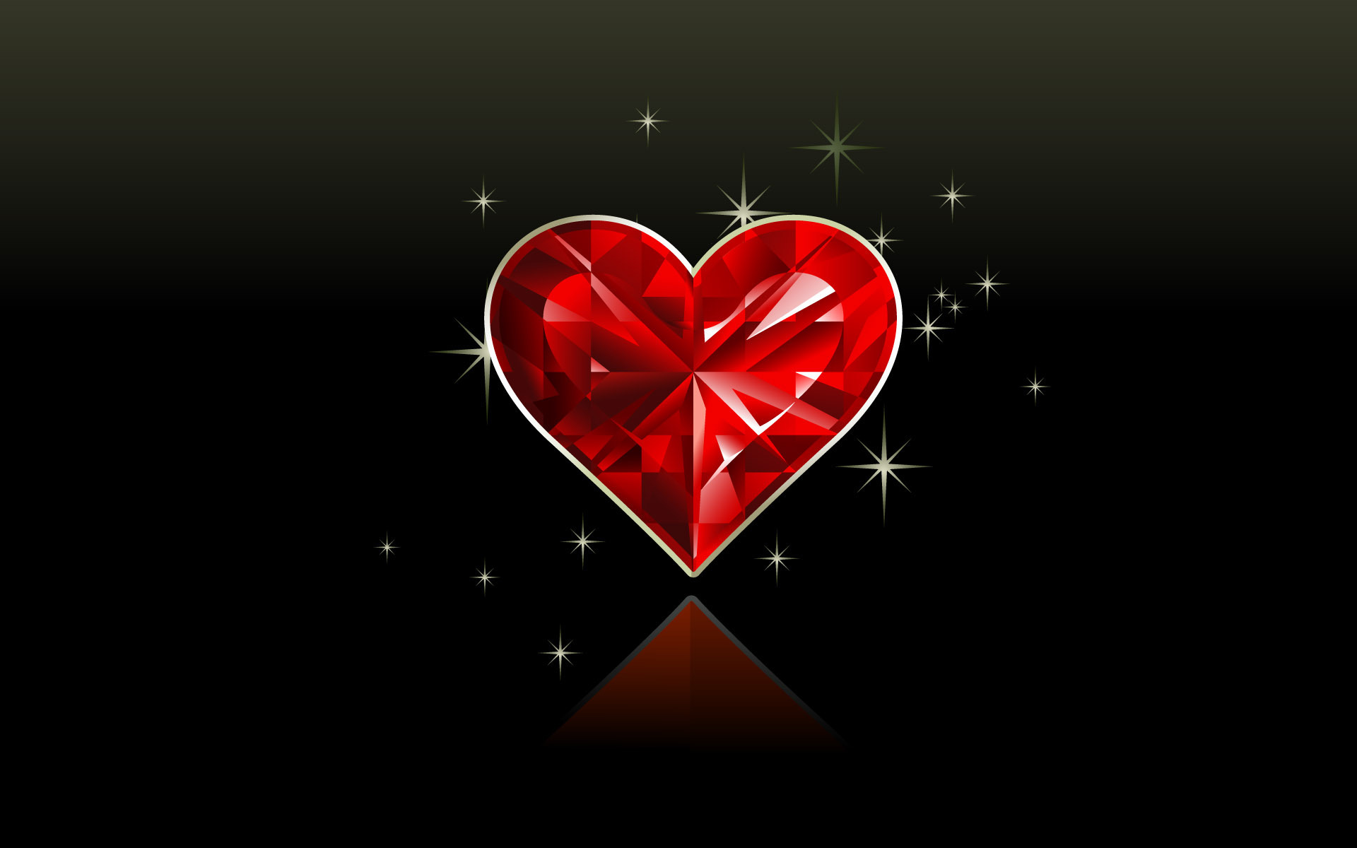 A sparkling red gemstone heart on a black background, symbolizing love and passion