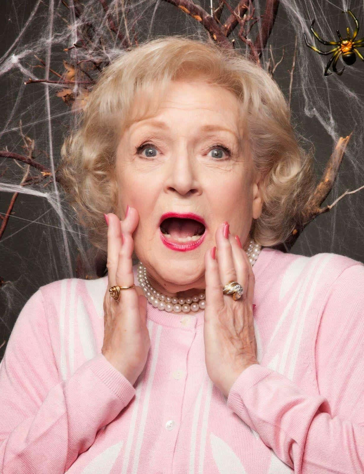 Betty White Smiling Radiantly In Photoshoot Wallpaper