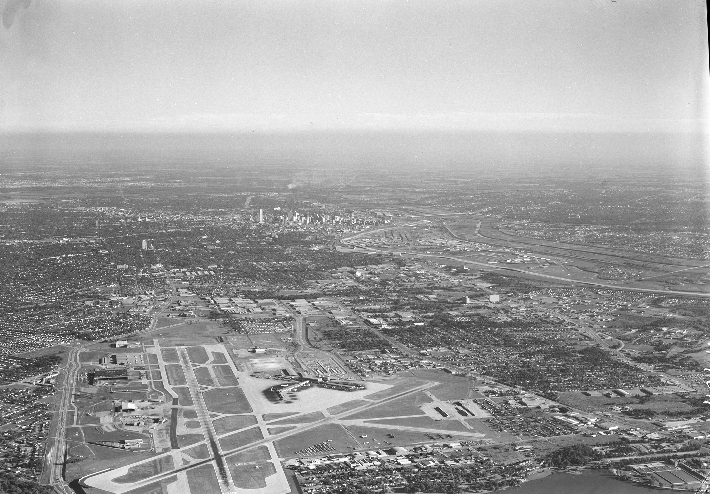 Aerial Of Dallas Love Field With Downtown Texas In