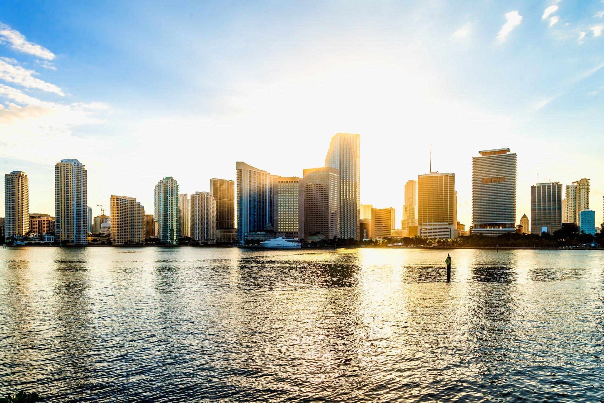 Sunset over the Miami skyline with reflections in the water