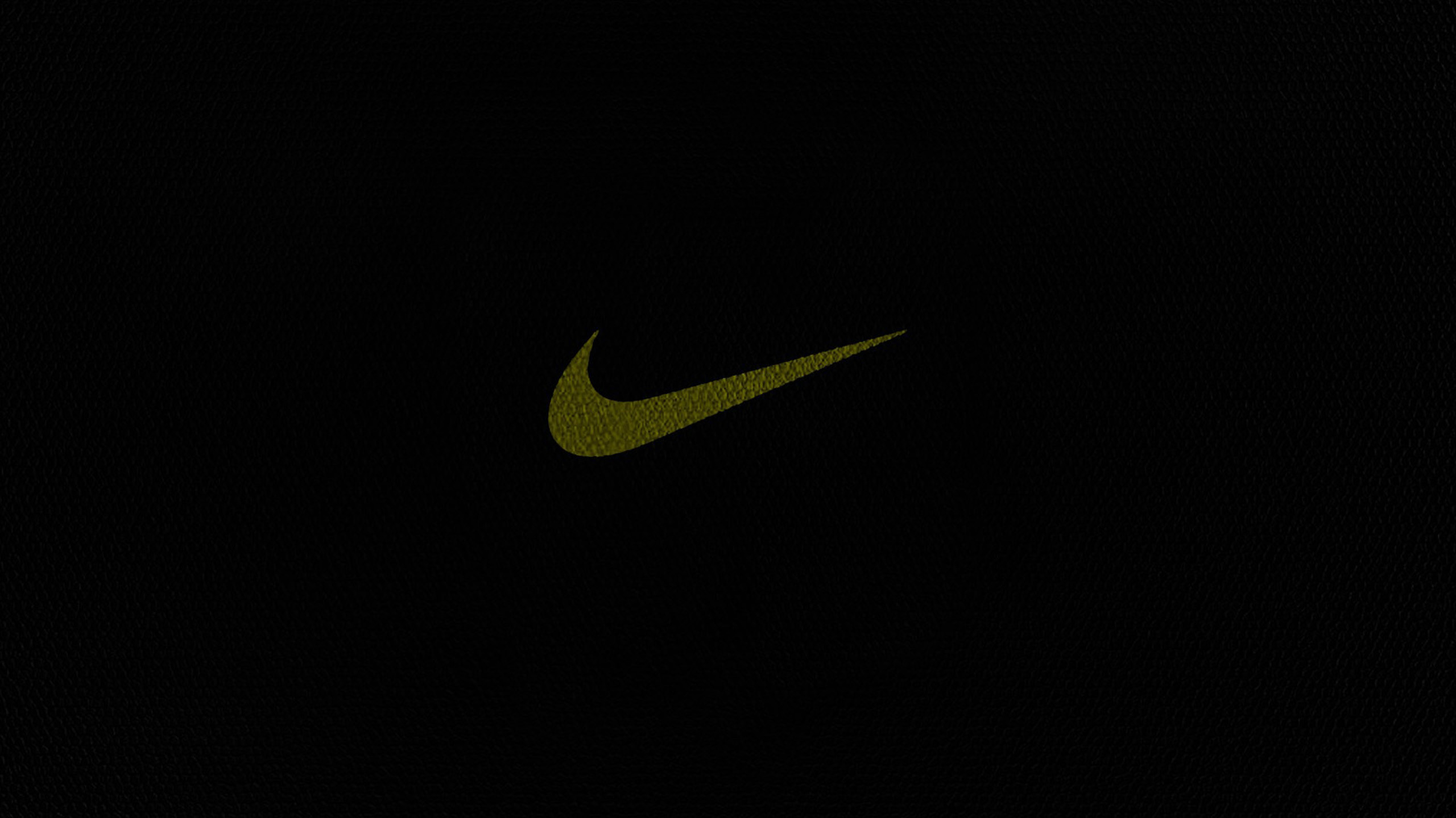 A minimalist Nike Football wallpaper with a gold Nike swoosh against a dark background