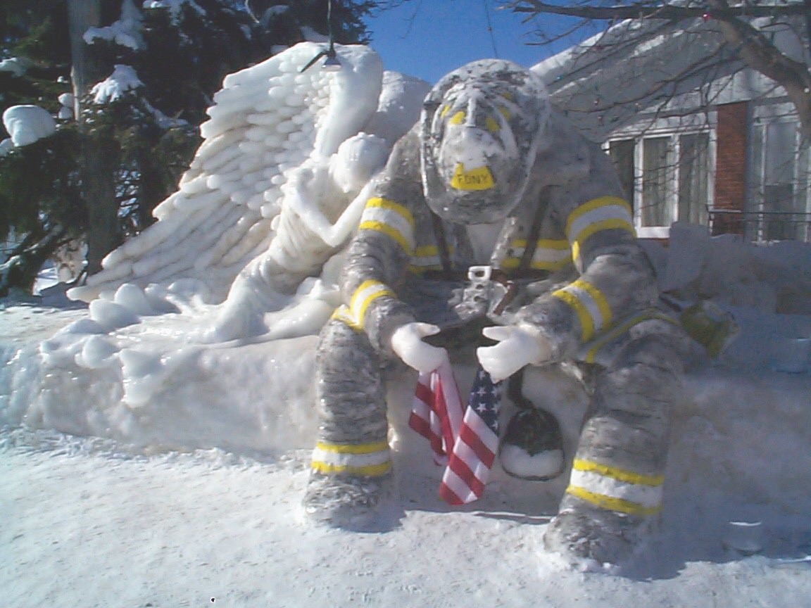 Angel With Fireman Ice Sculpture Click This Image For An Enlarged
