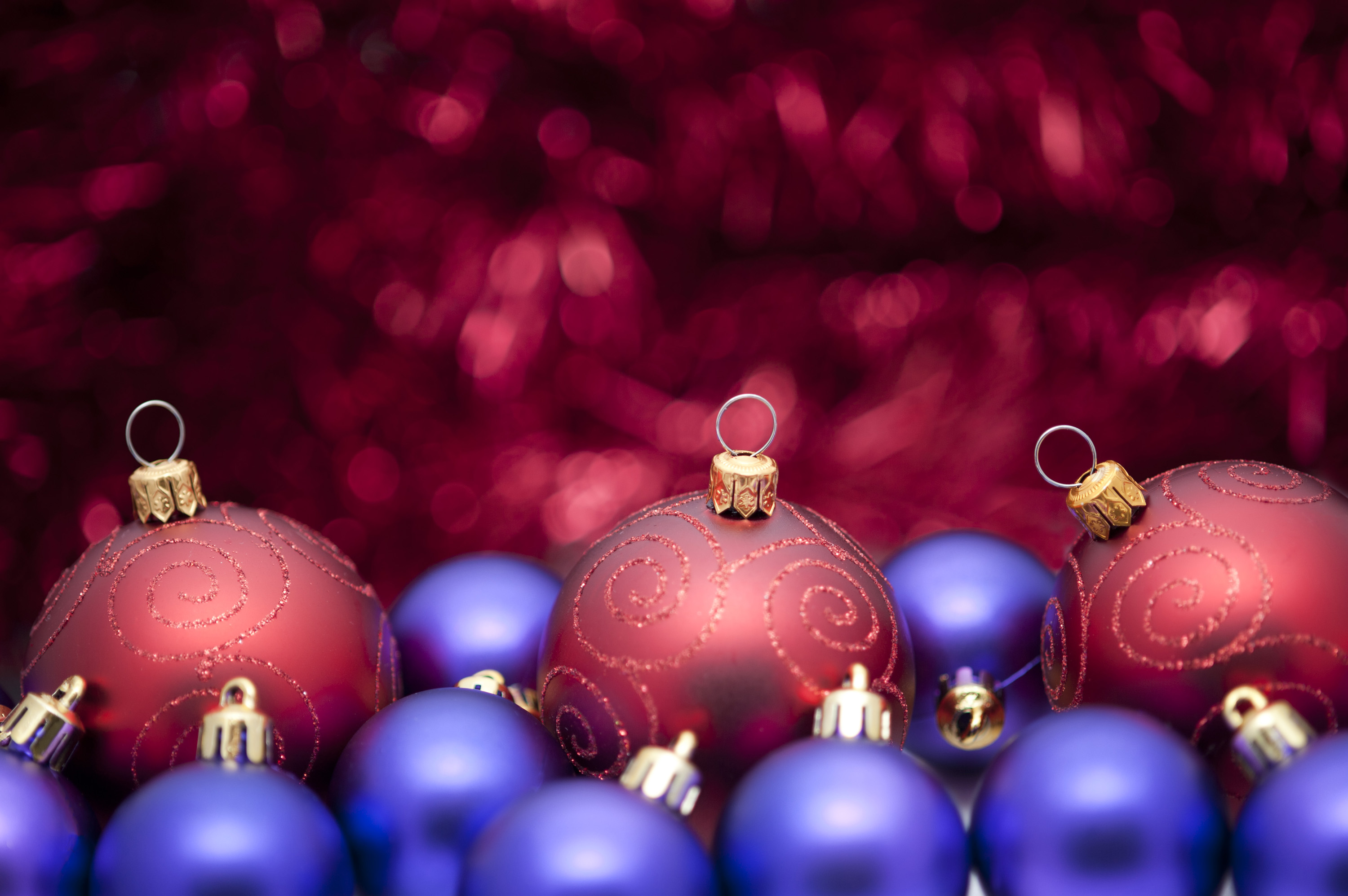 Sumptuous Red And Purple Coloured Christmas Background Baubles In