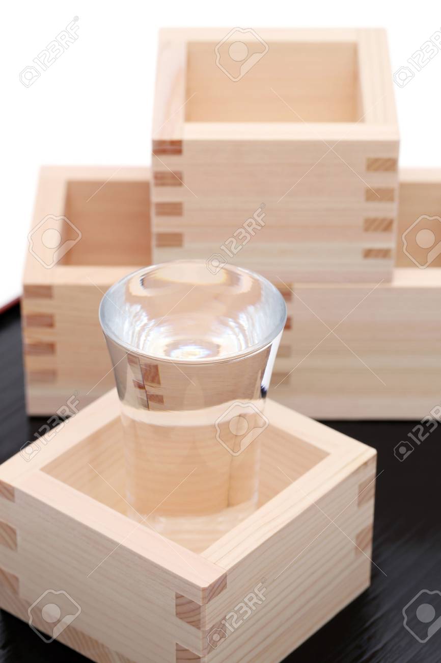 Japanese Wooden Box Masu With Sake On White Background Stock Photo