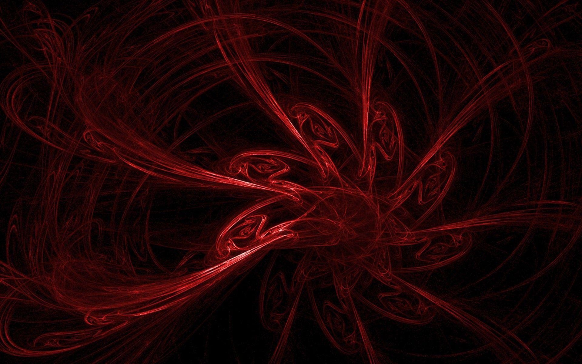 A mesmerizing red abstract fractal design on a black background. The intricate patterns and vibrant color create a visually striking image