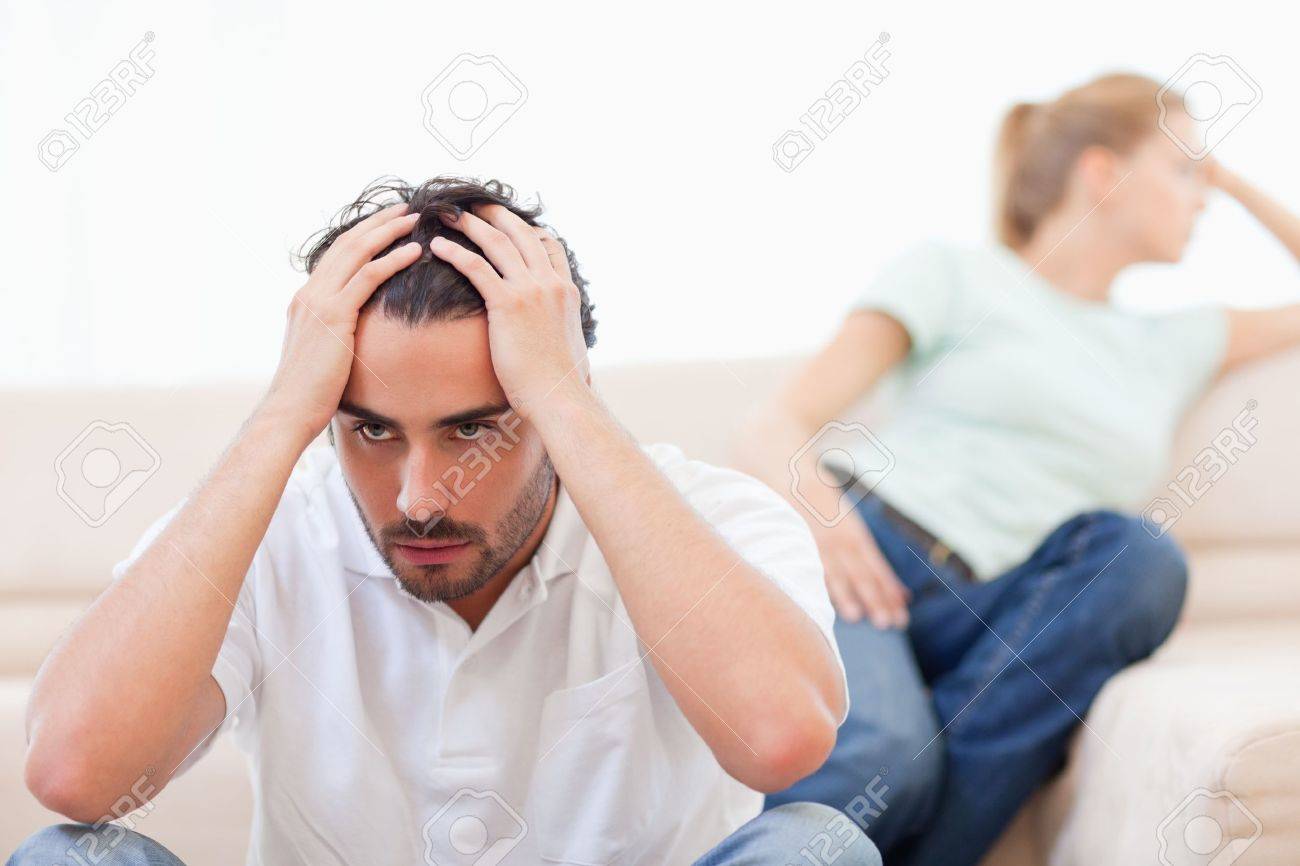 Angry Couple Mad At Each Other In Their Living Room Stock Photo