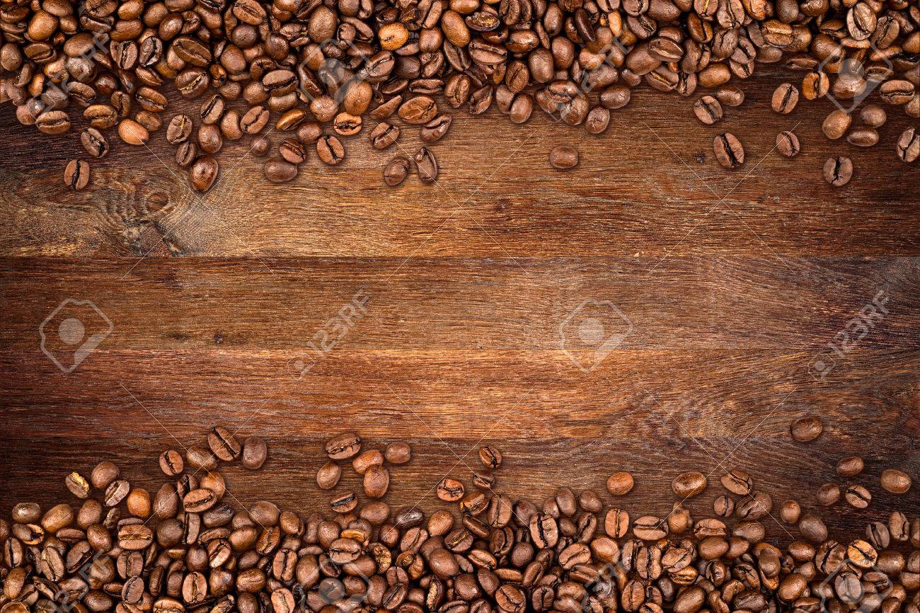 Coffee Beans On Rustic Oak Background Stock Photo Picture And