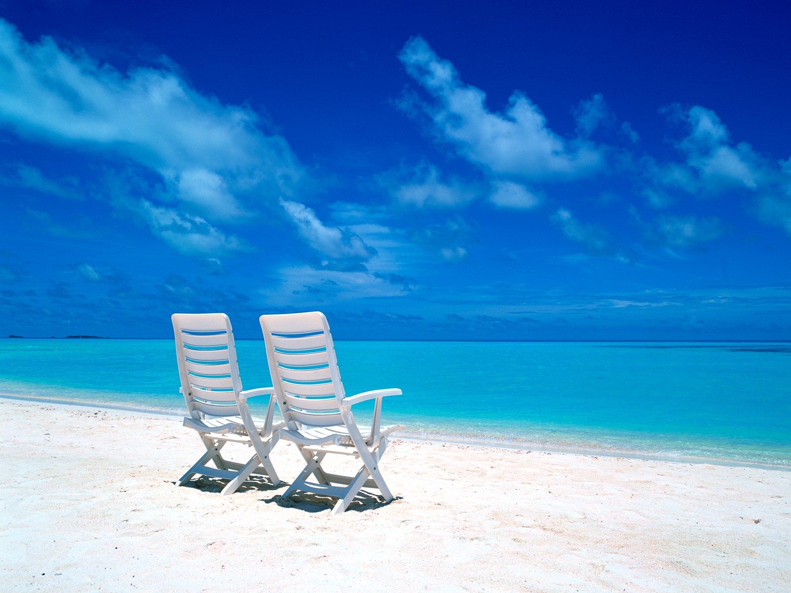 Chairs On The Beach Wallpaper
