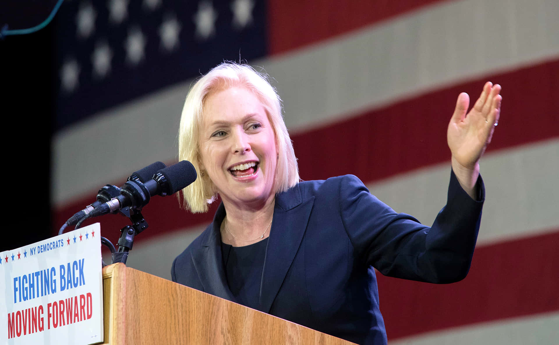 Senator Kirsten Gillibrand Extending Her Left Hand In A Wallpaper