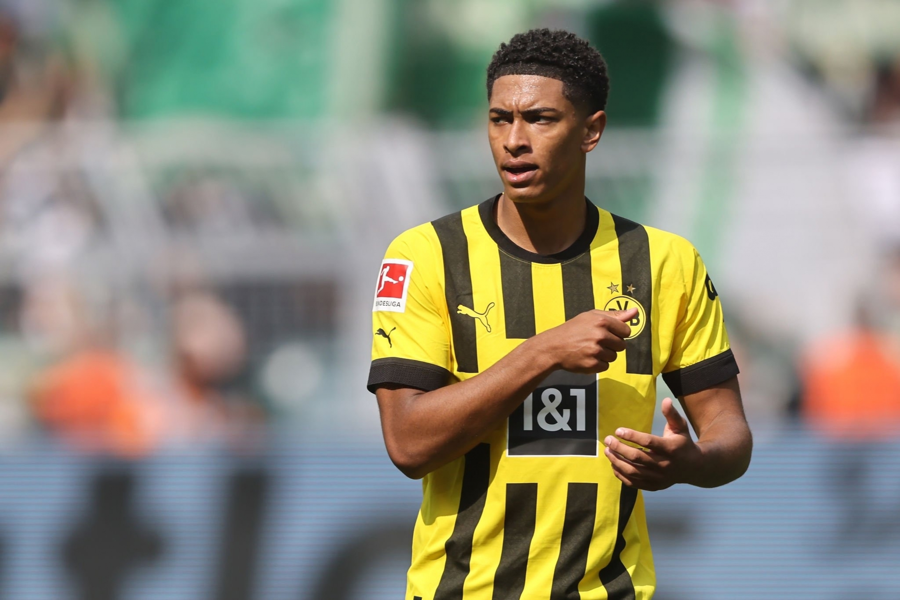 Jude Bellingham in action during a football match, wearing his Borussia Dortmund jersey