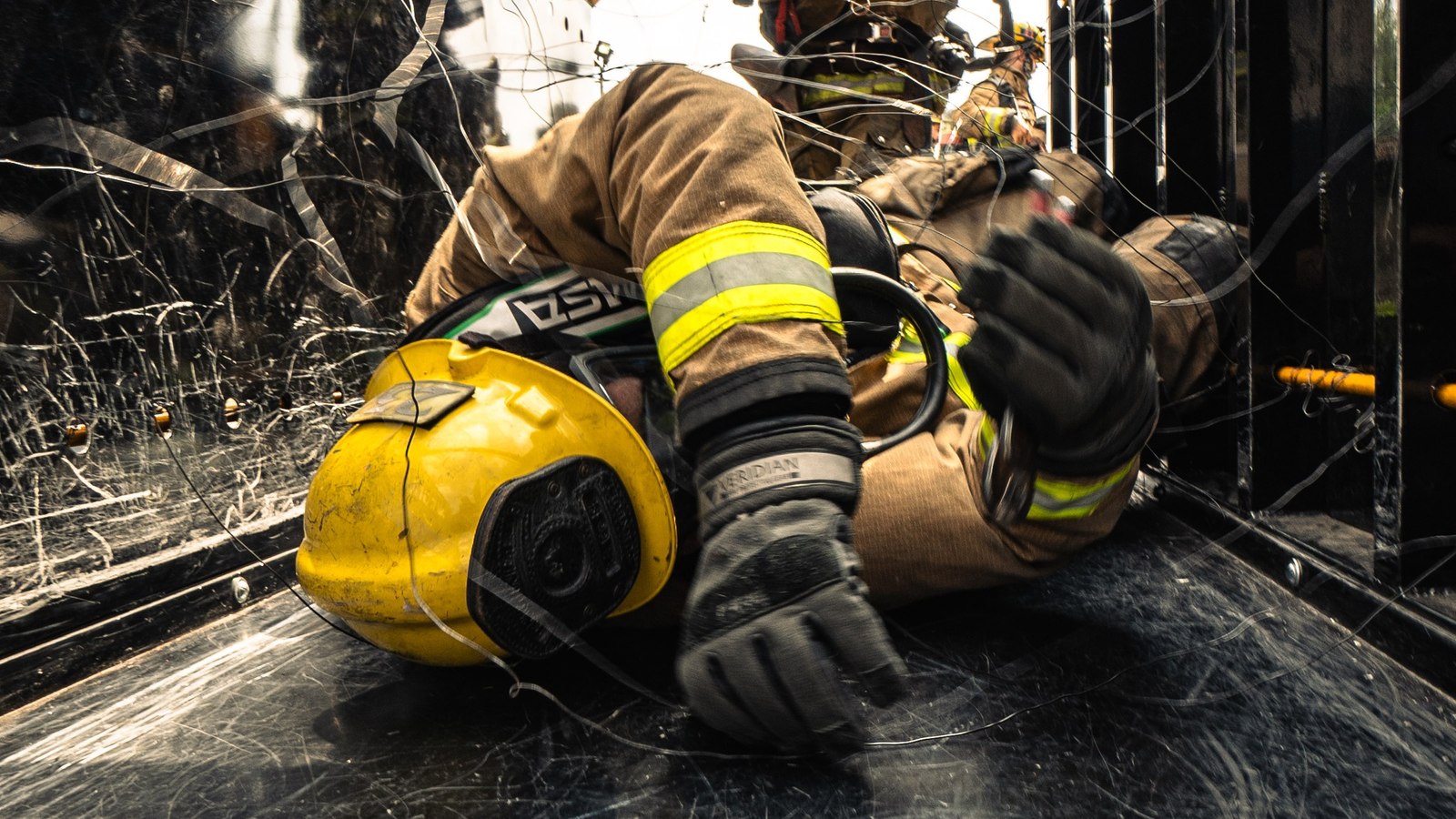 A Los Angeles firefighter navigates a challenging training scenario, demonstrating their commitment to safety and preparedness