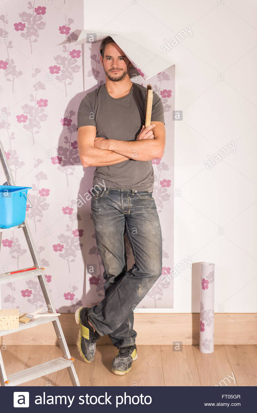 Looking At Camera Humorous Handyman Posing Wallpaper Poses With