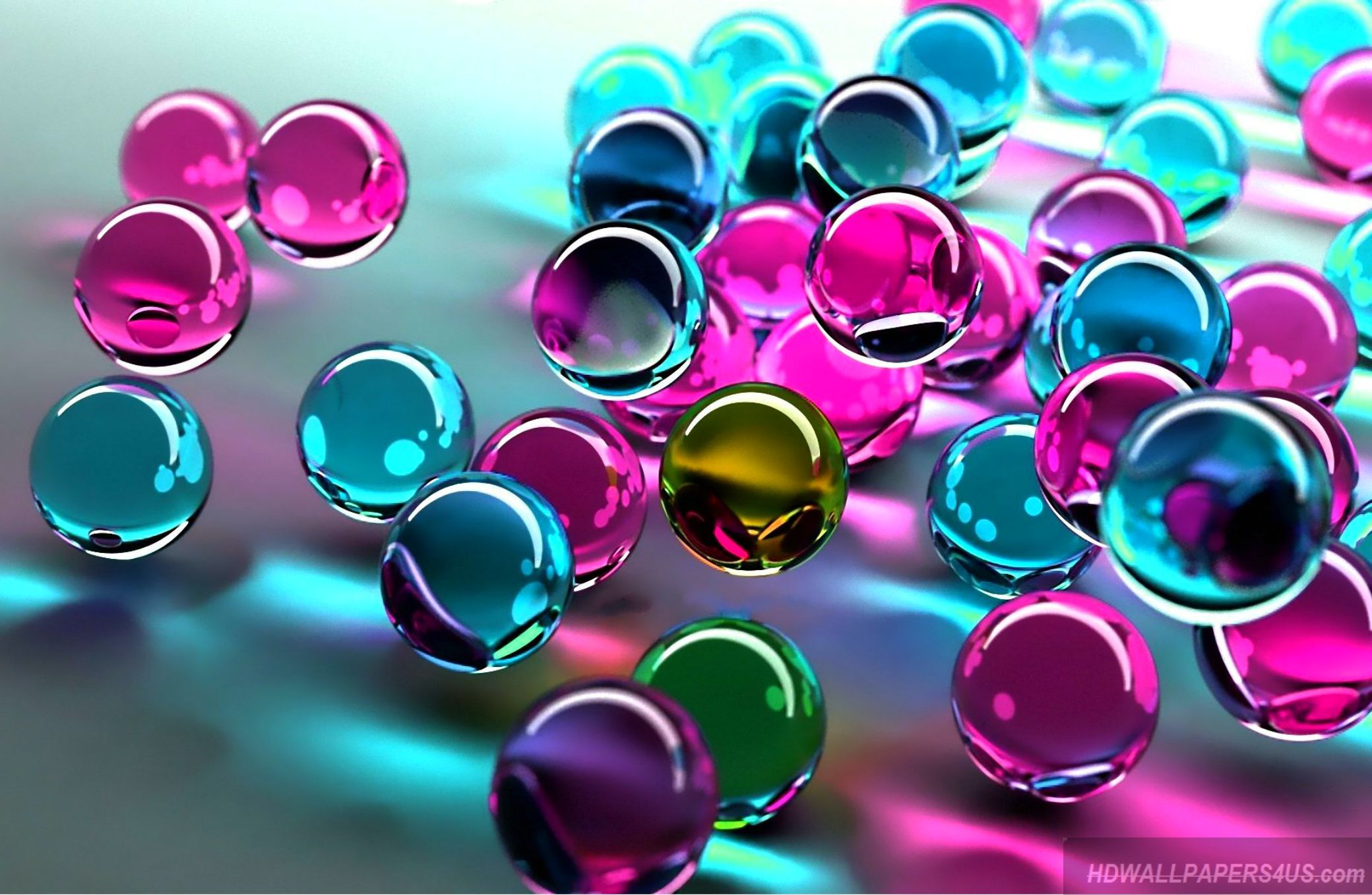Colorful translucent spheres on a reflective surface, creating a vibrant abstract image