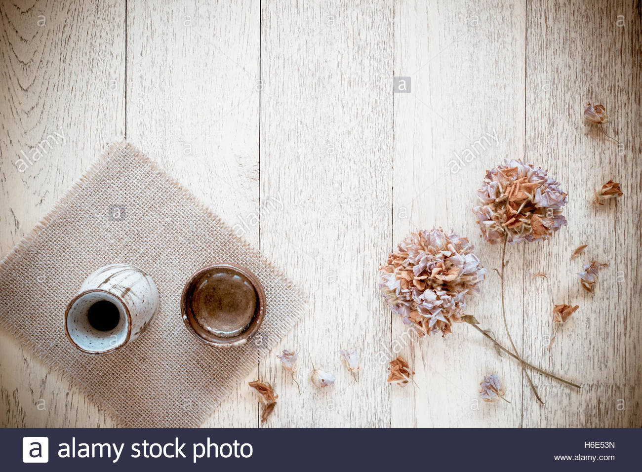 Japanese Traditional Sake Cup And Bottle On A Wooden Background