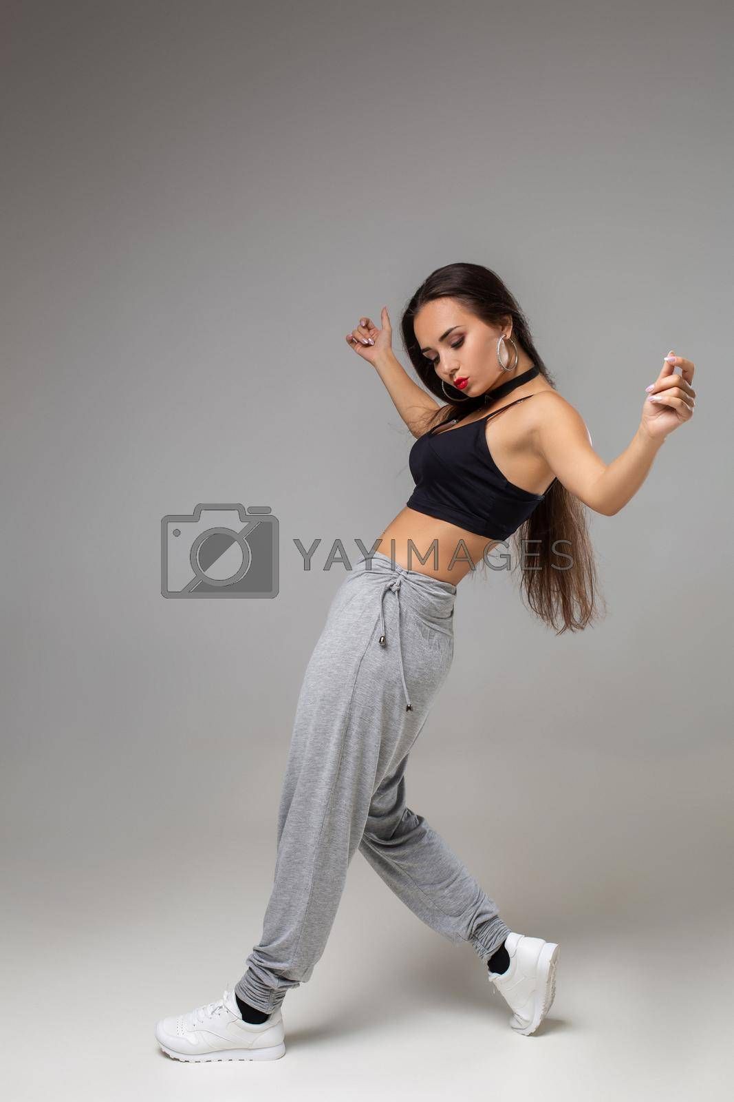 Modern Dancer Poses In Front Of The Gray Studio Background By Wallpaper