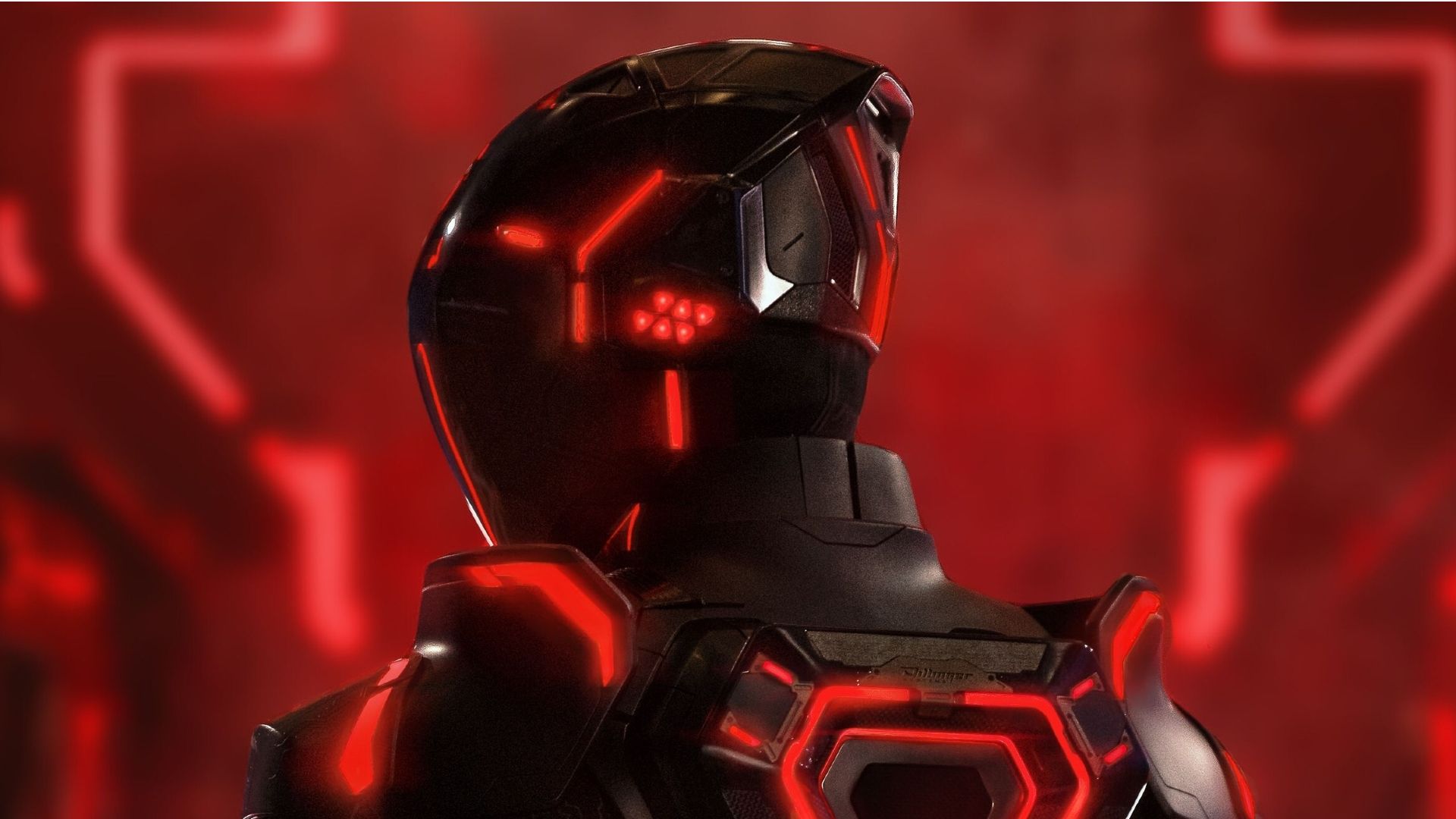 A futuristic figure with a helmet and glowing red accents against a blurred red background