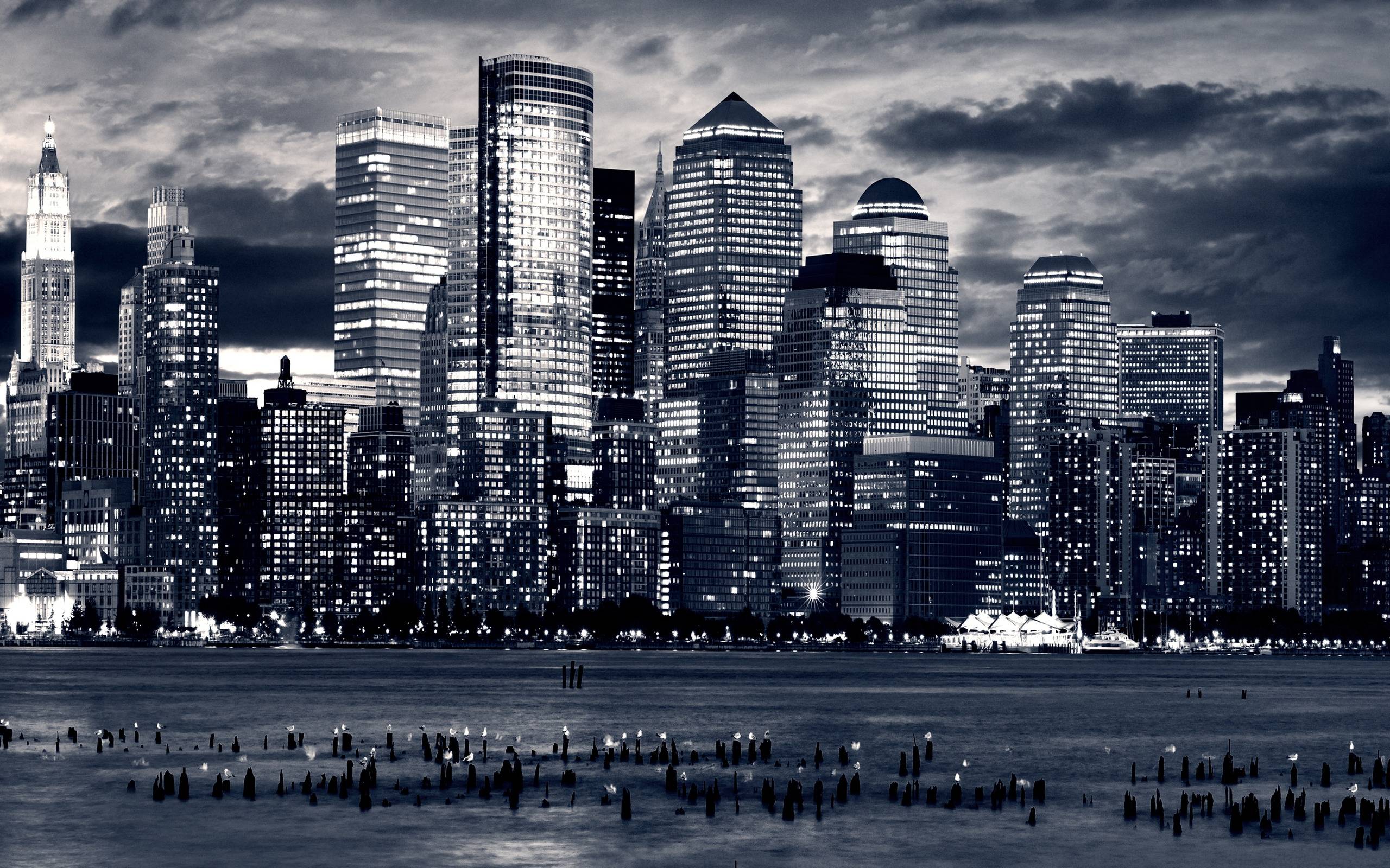 Dramatic black and white image of the New York City skyline at night