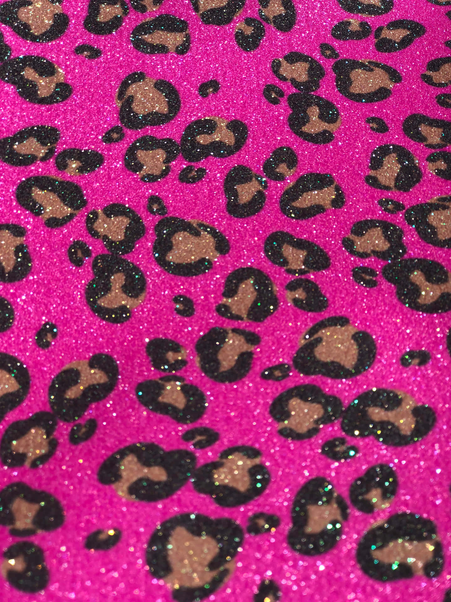 Close-up of vibrant pink glitter leopard print wallpaper, showcasing a bold and glamorous design