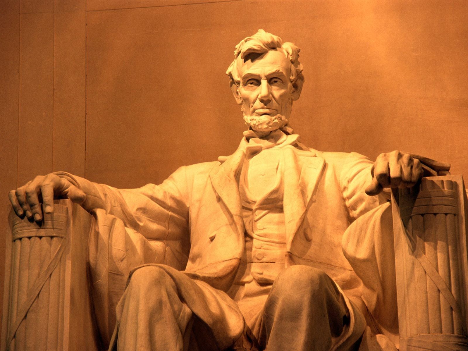 A majestic statue of Abraham Lincoln, the 16th US President, seated in contemplation