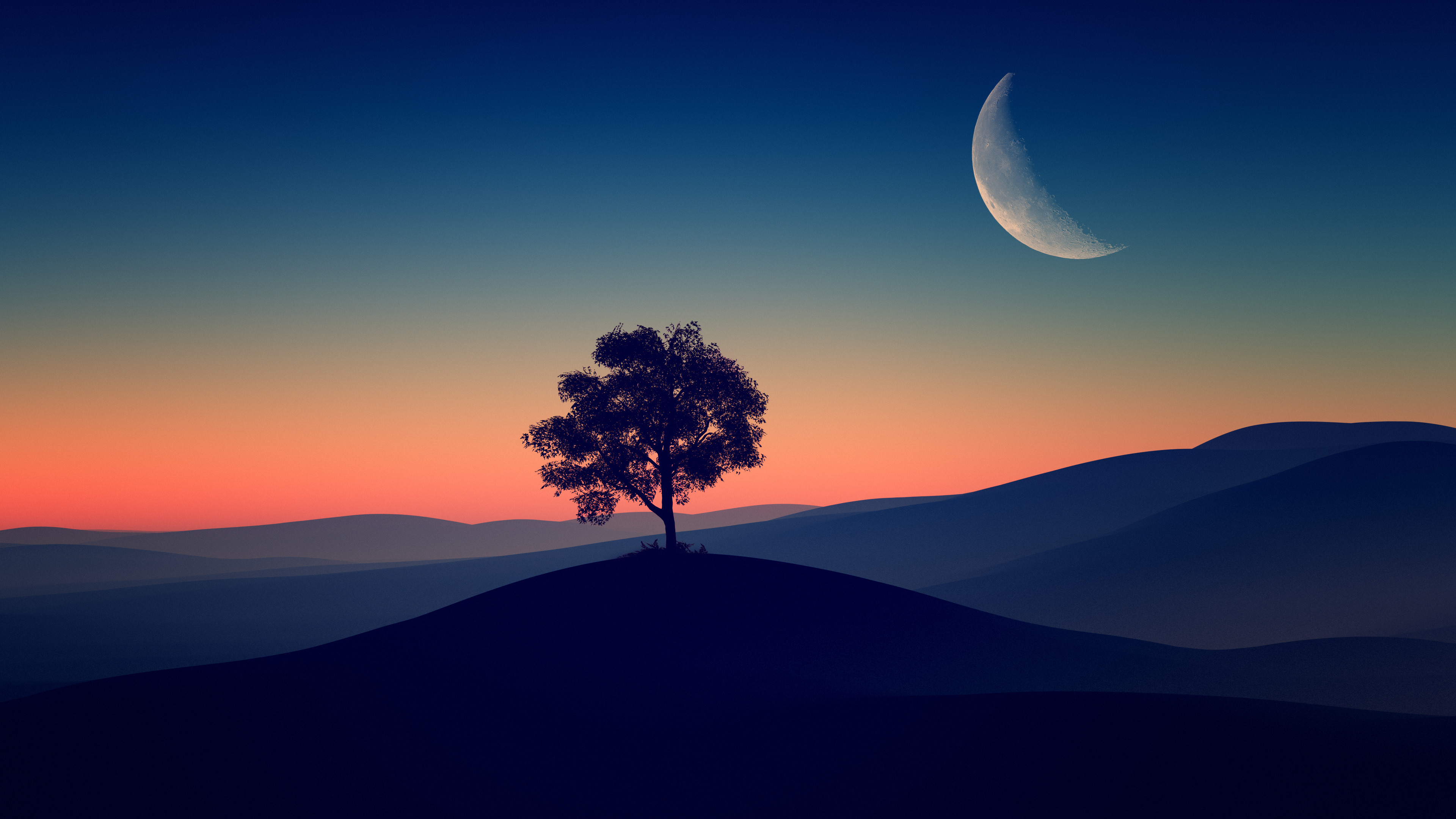 A lone tree silhouetted against a vibrant sunset sky with a crescent moon, overlooking rolling hills