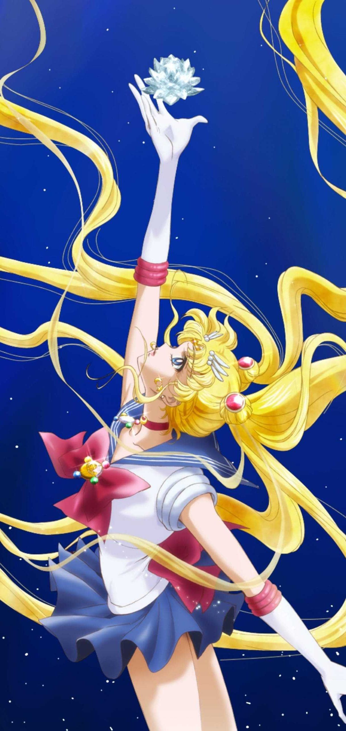 Sailor Moon reaching for the Silver Crystal against a starry night sky