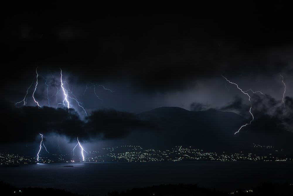 Lightning Strike On Mountain During Night Time Photo Image