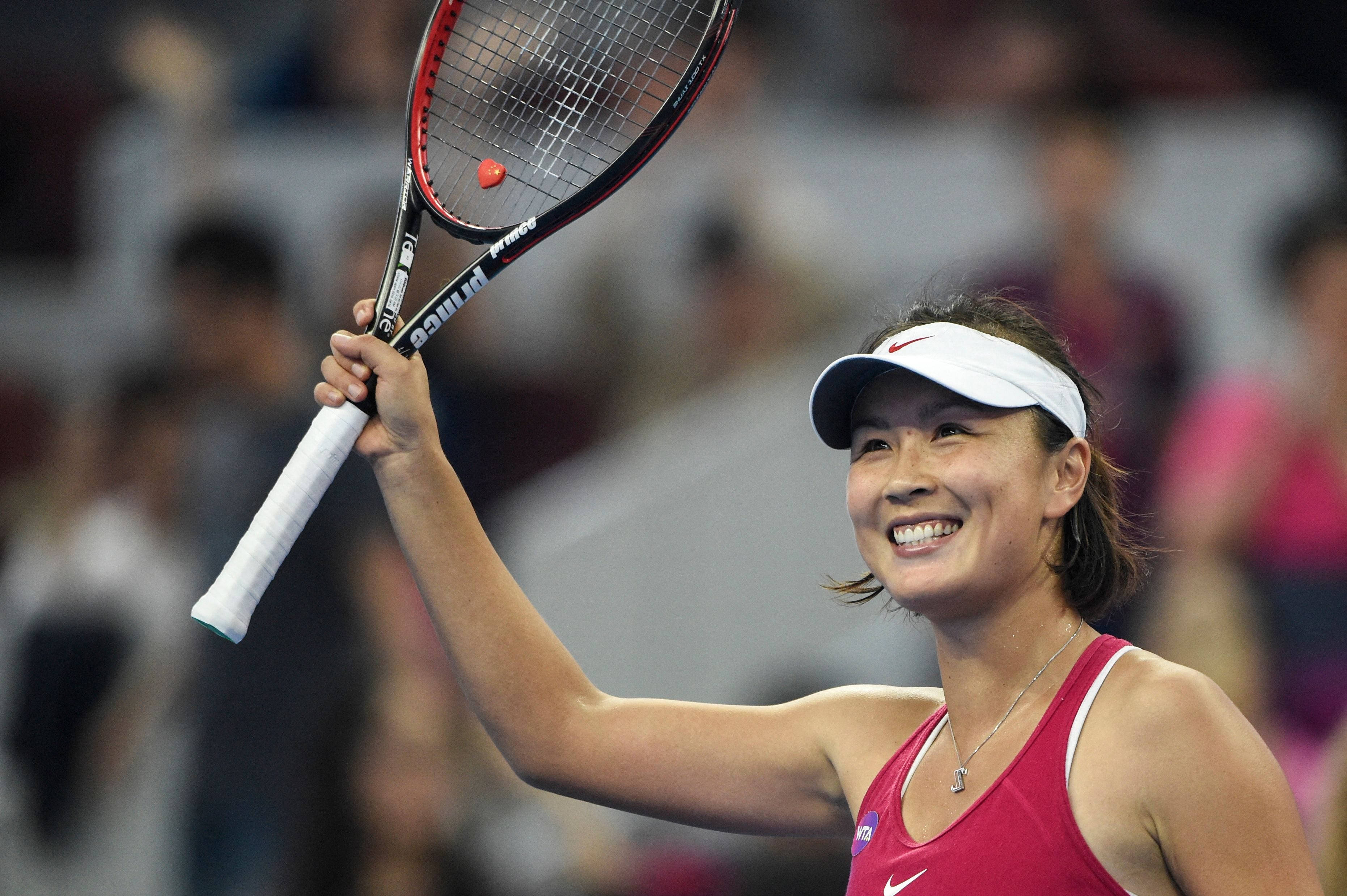 Shuai Peng Raising Her Racket Wallpaper