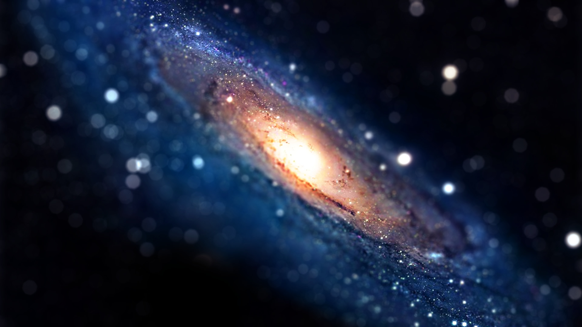 A breathtaking spiral galaxy with a bright, glowing core, set against a backdrop of sparkling stars. Perfect for a desktop wallpaper