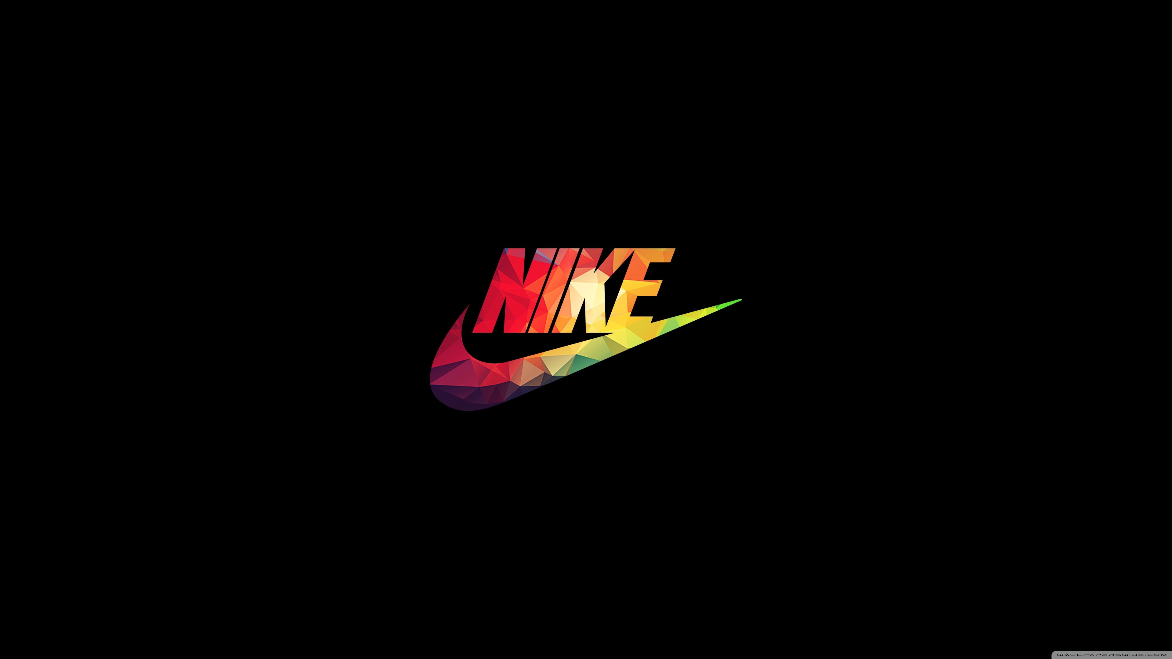 A stylized, polygonal Nike logo in a rainbow of colors against a black background