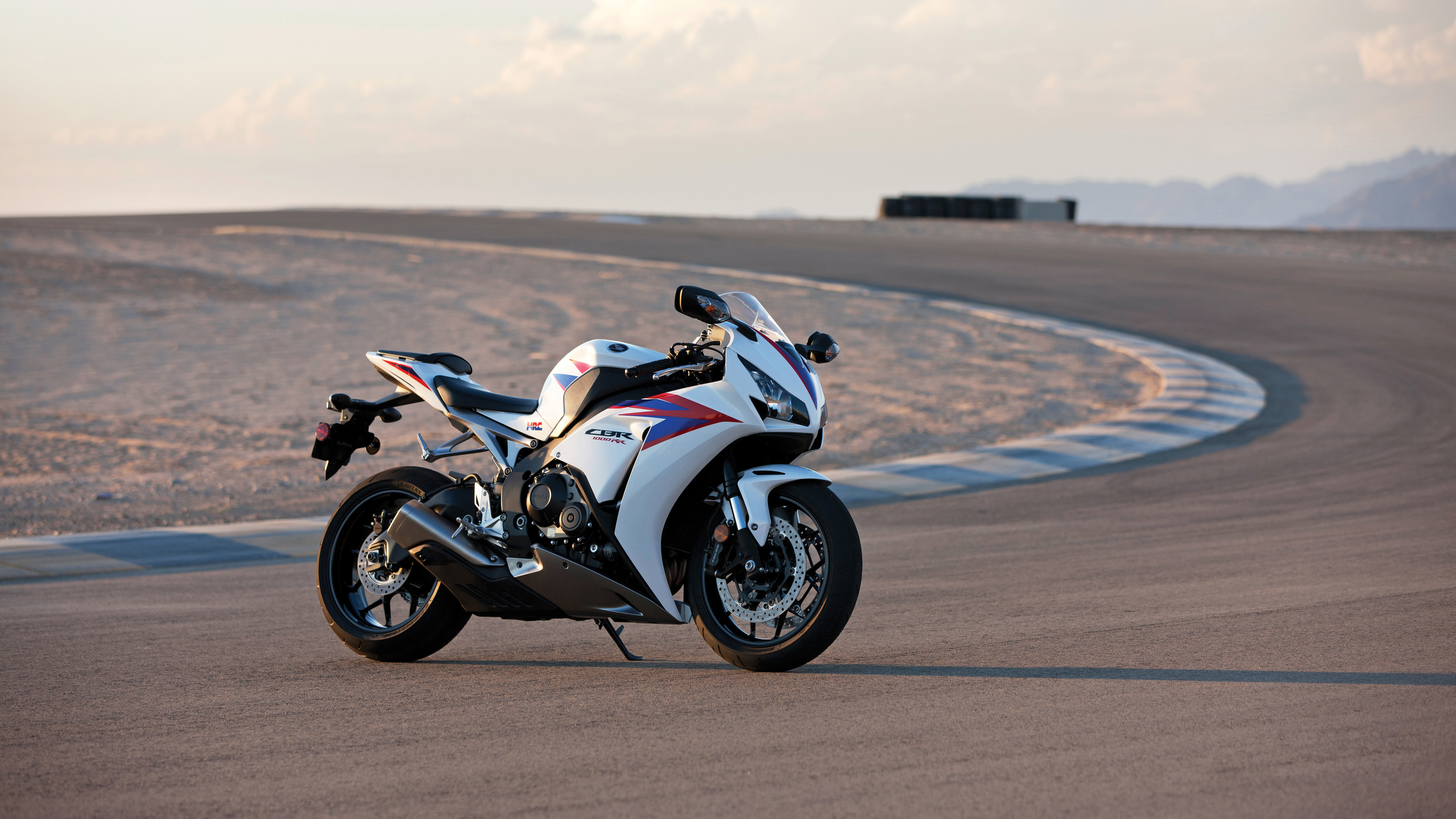 White Honda CBR Motorcycle on a Racetrack