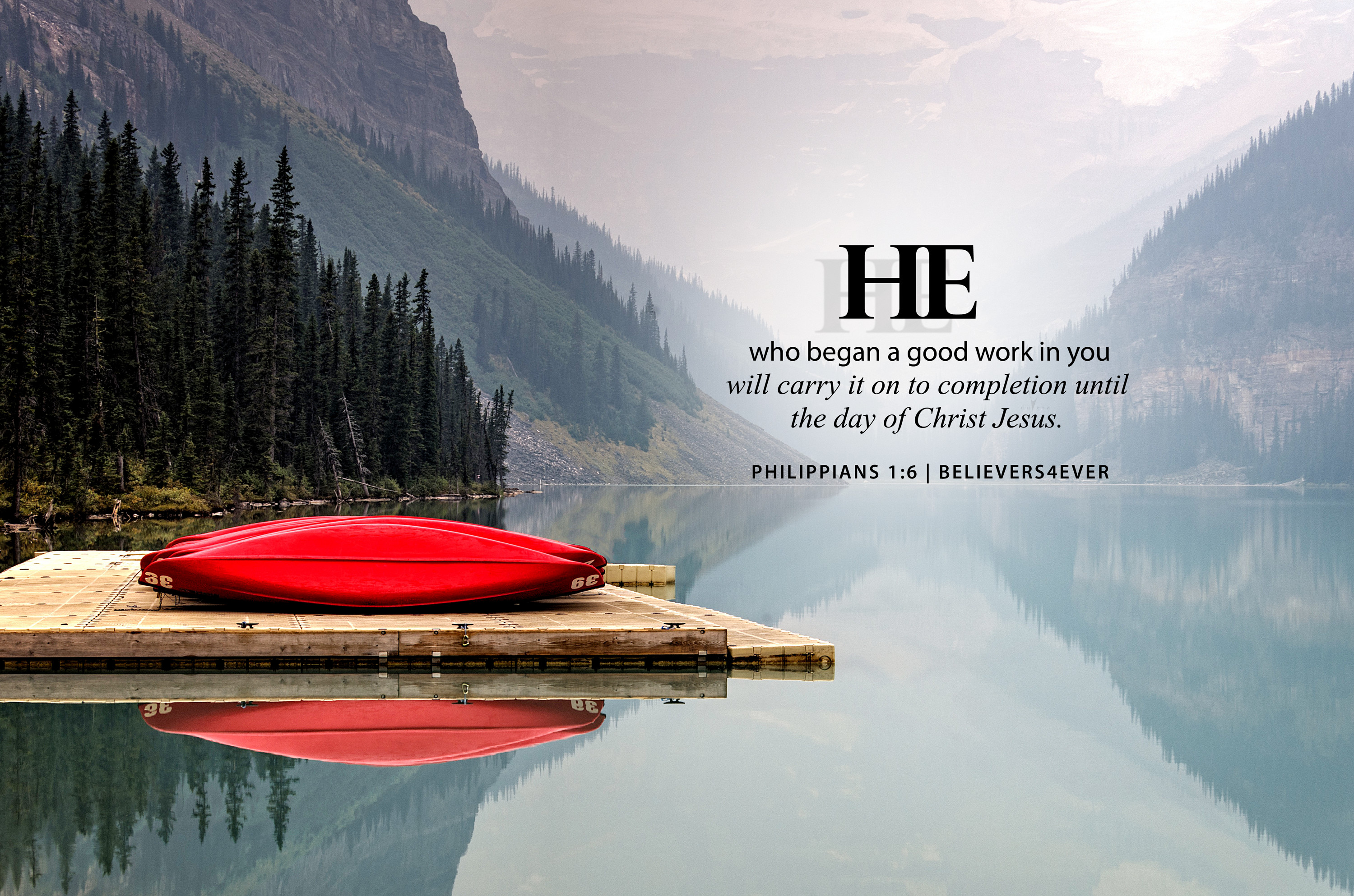 A scenic mountain lake with red canoes. The overlay text presents a bible verse from Philippians 1:6, stating 