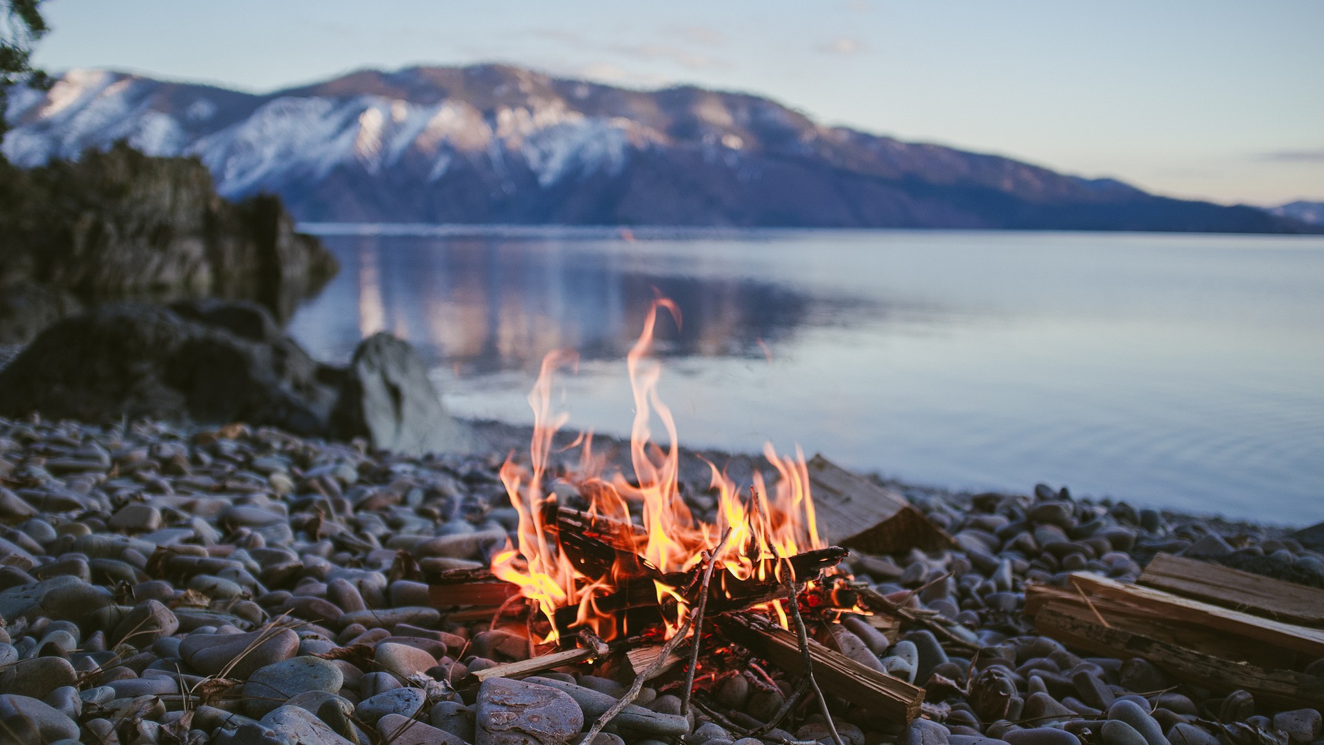 Bonfire On The Pebbles Shore Of Lake Wallpaper